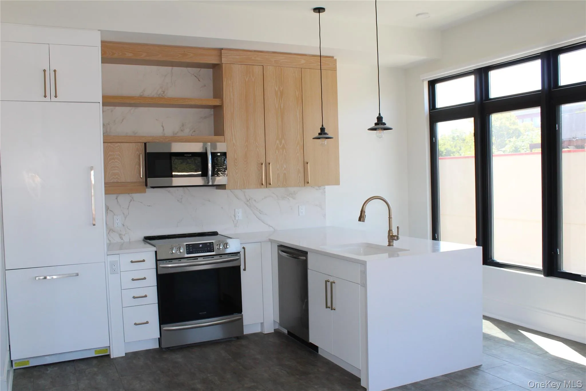 Kitchen with open shelves, appliances with stainless steel finishes, tasteful backsplash, a peninsula, and pendant lighting Kitchen with open shelves, appliances with stainless steel finishes, tasteful backsplash, a peninsula, and pendant lighting