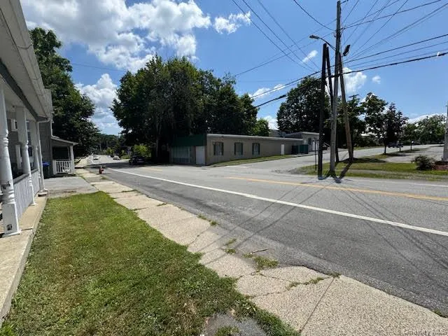 View of asphalt street featuring street lighting View of asphalt street featuring street lighting