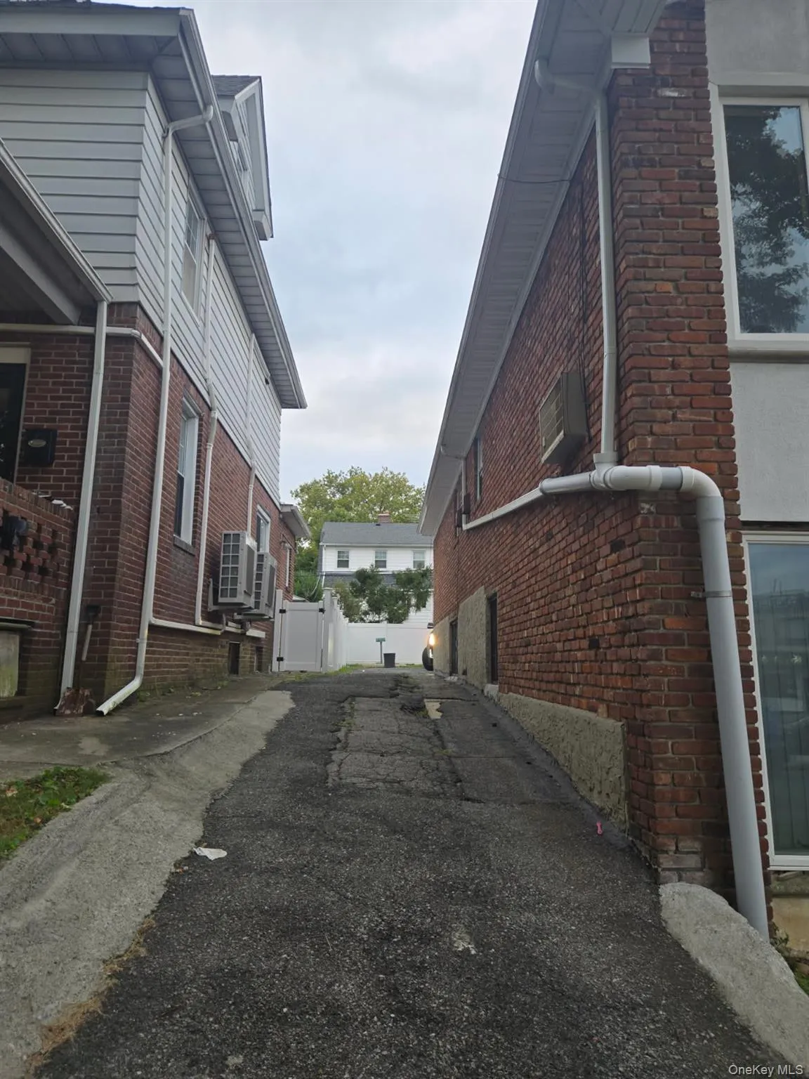 View of side of home featuring brick siding View of side of home featuring brick siding