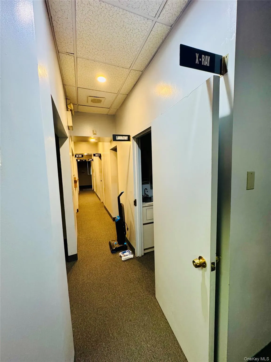 Hallway with a drop ceiling Hallway with a drop ceiling