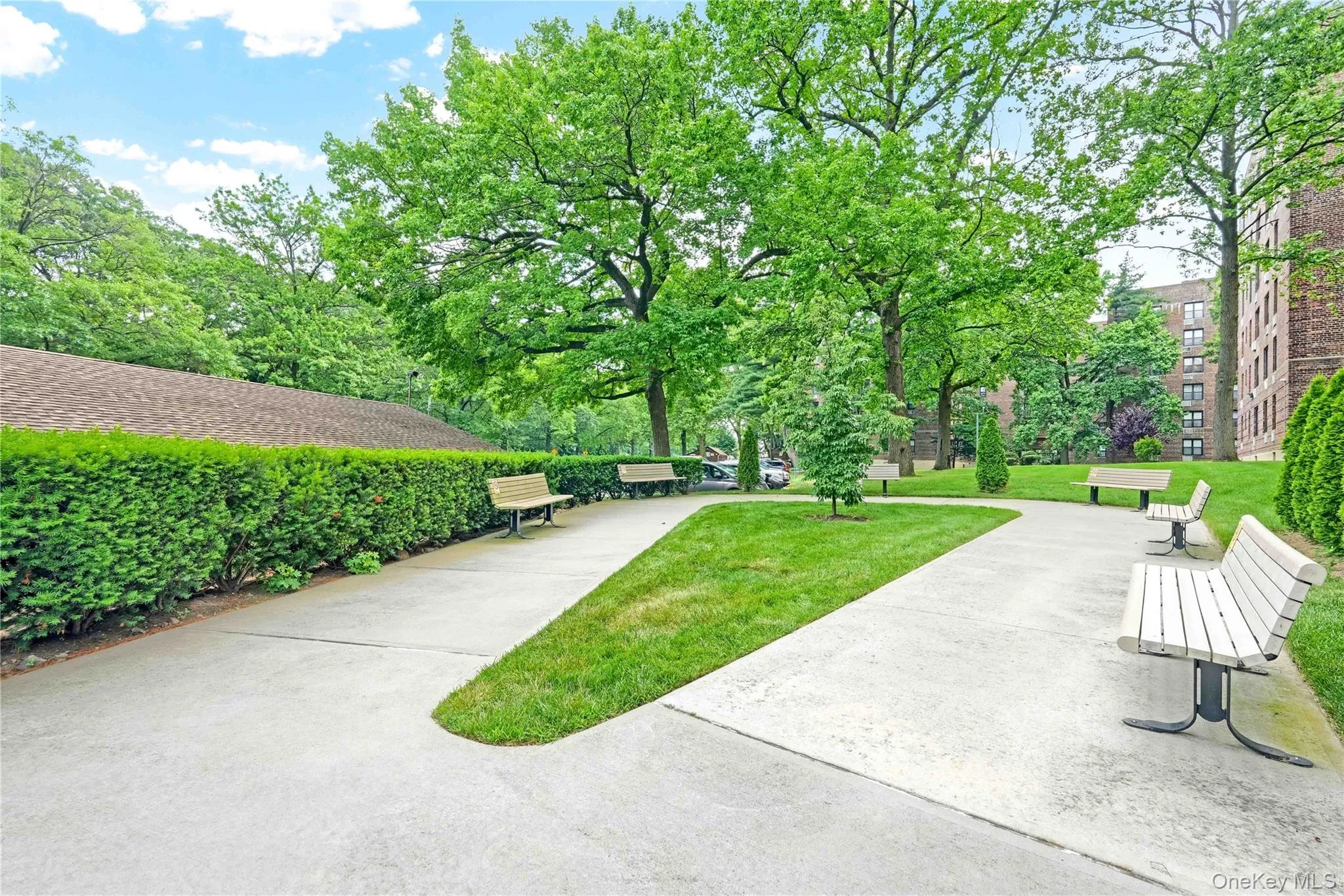 Surrounding community with a lawn and view of scattered trees Surrounding community with a lawn and view of scattered trees
