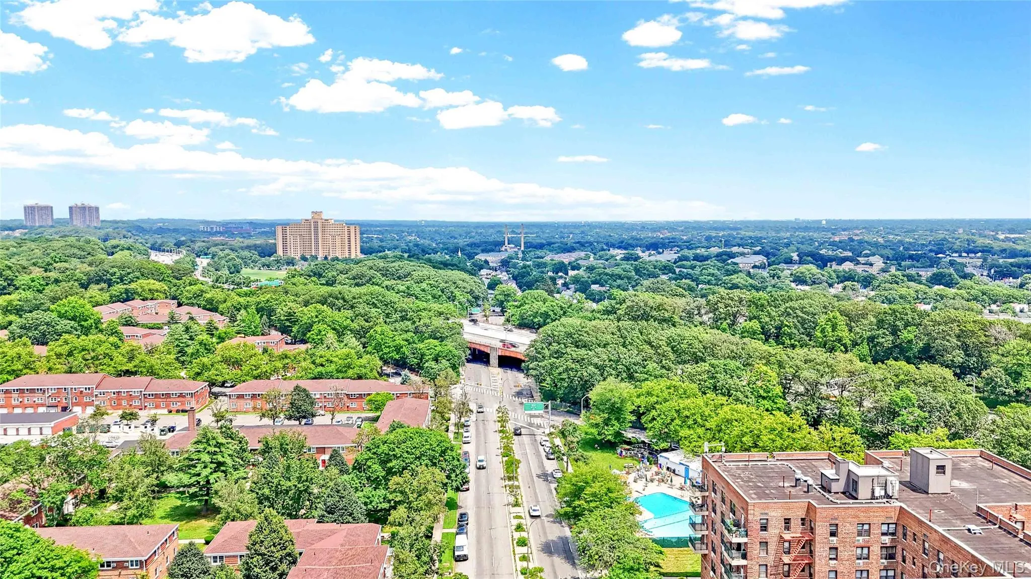 View of urban area featuring a tree filled landscape View of urban area featuring a tree filled landscape