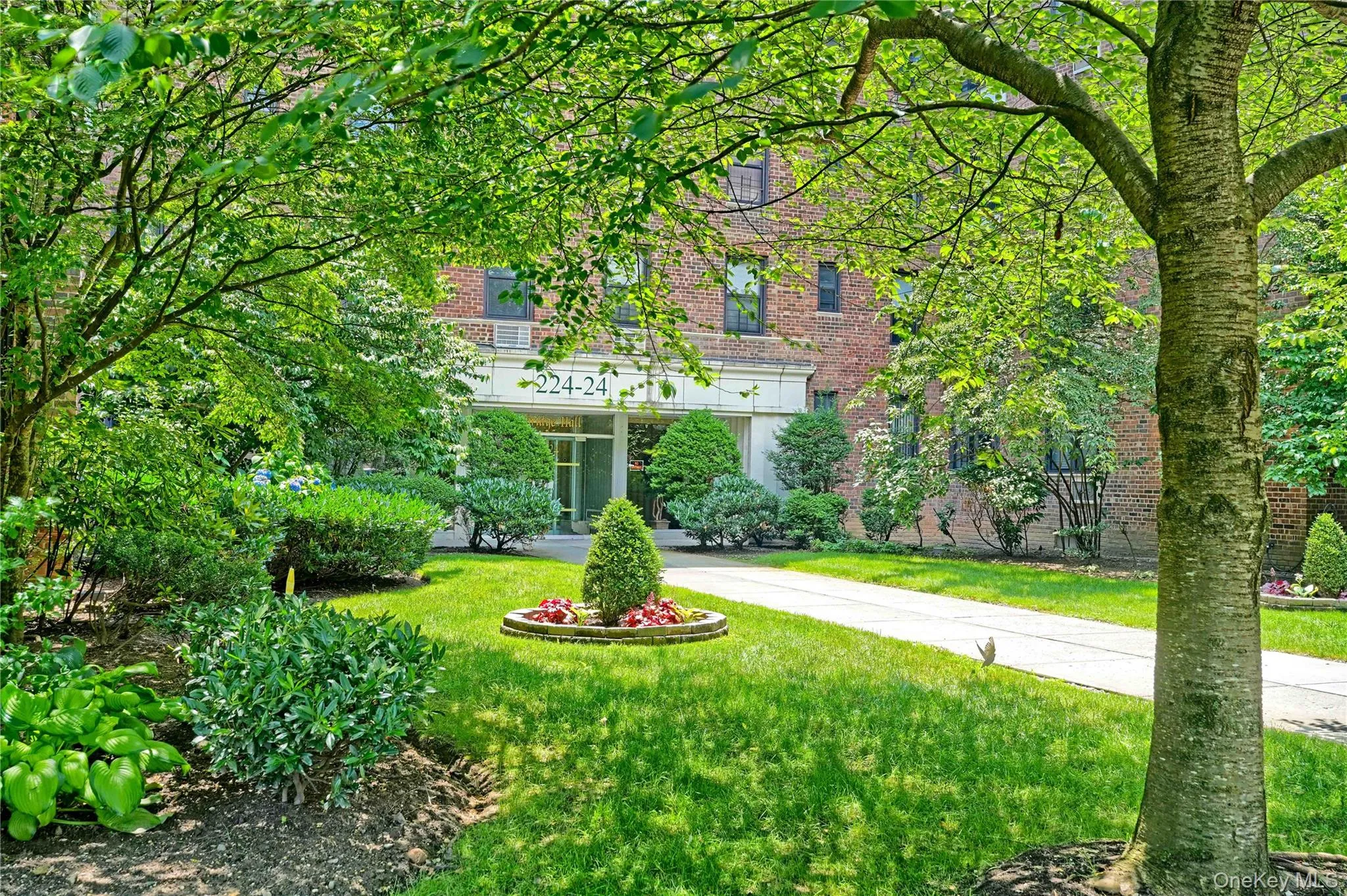 View of front of home with brick siding and a front yard View of front of home with brick siding and a front yard