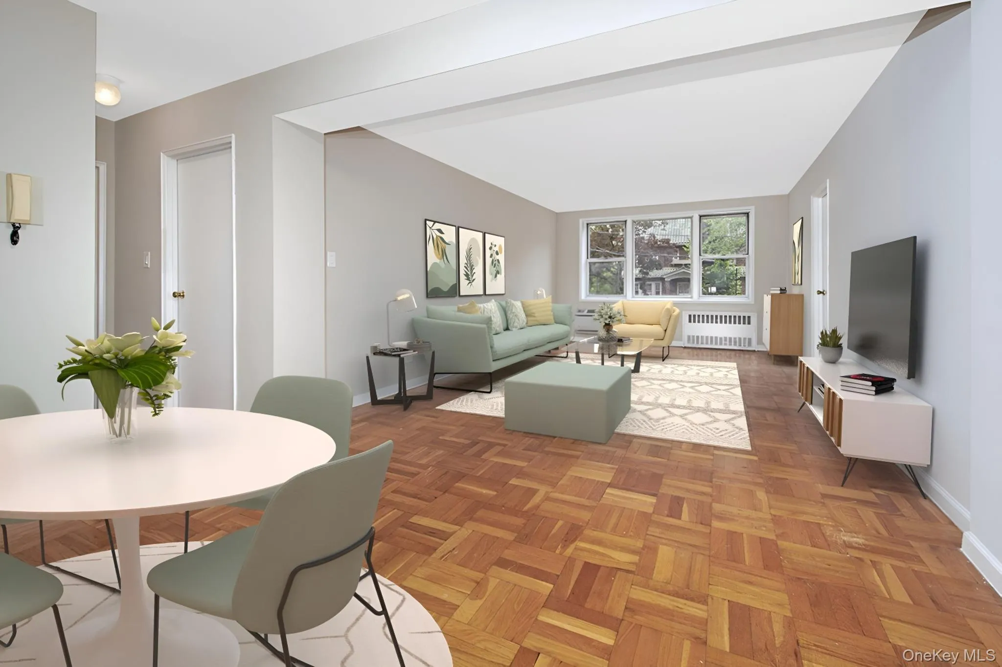 Living area with radiator heating unit and baseboards Living area with radiator heating unit and baseboards