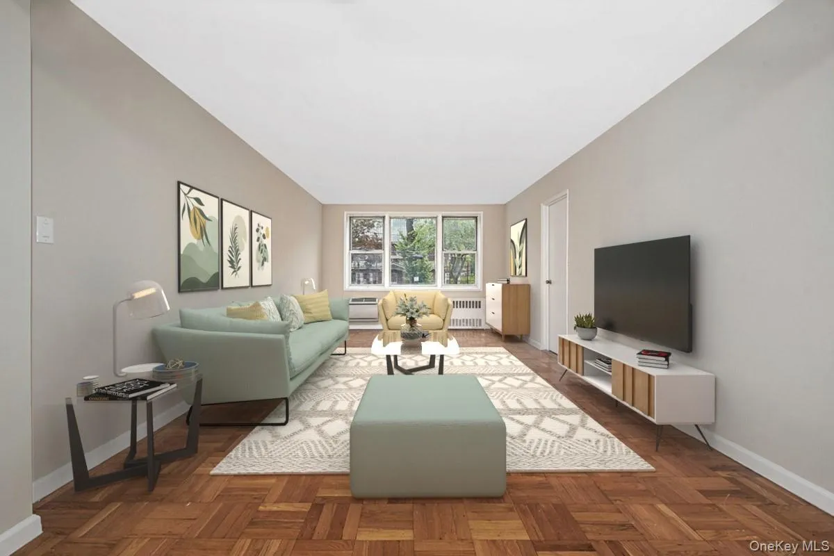 Living room with baseboards and radiator Living room with baseboards and radiator