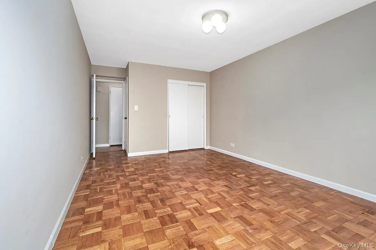 Unfurnished bedroom with baseboards and a closet Unfurnished bedroom with baseboards and a closet