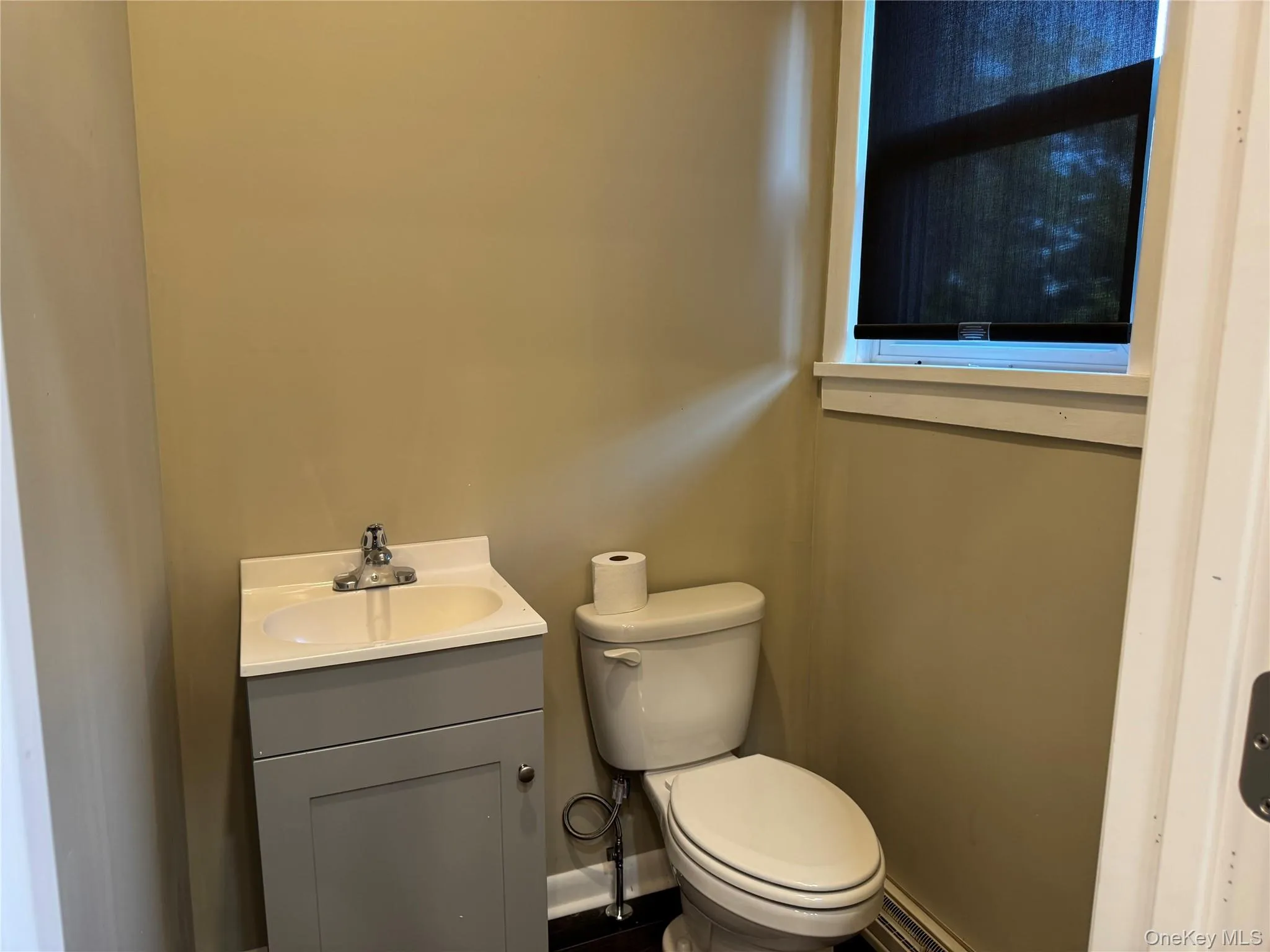 Half Bathroom with a vanity Half Bathroom with a vanity