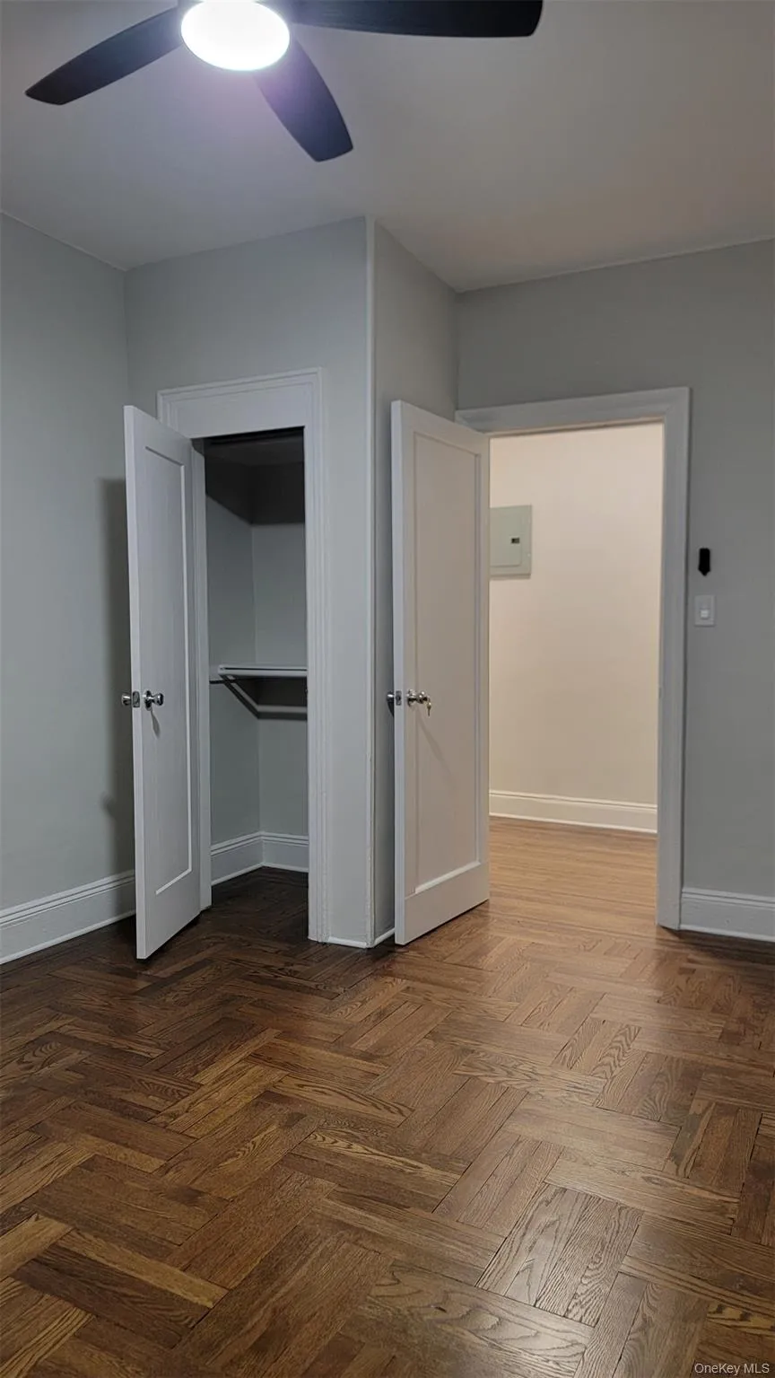 Unfurnished bedroom with baseboards and ceiling fan Unfurnished bedroom with baseboards and ceiling fan