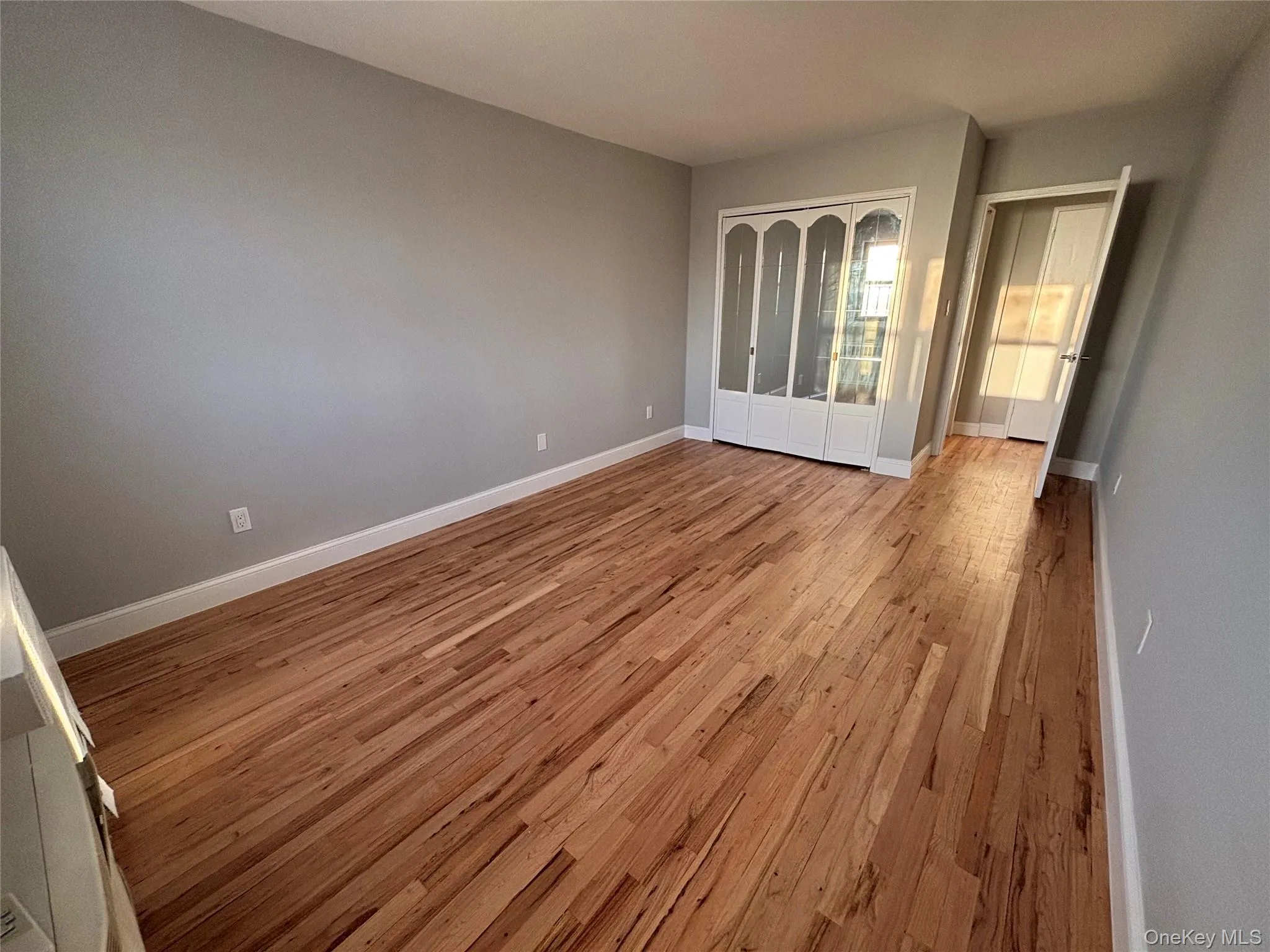 Empty room featuring light wood finished floors Empty room featuring light wood finished floors