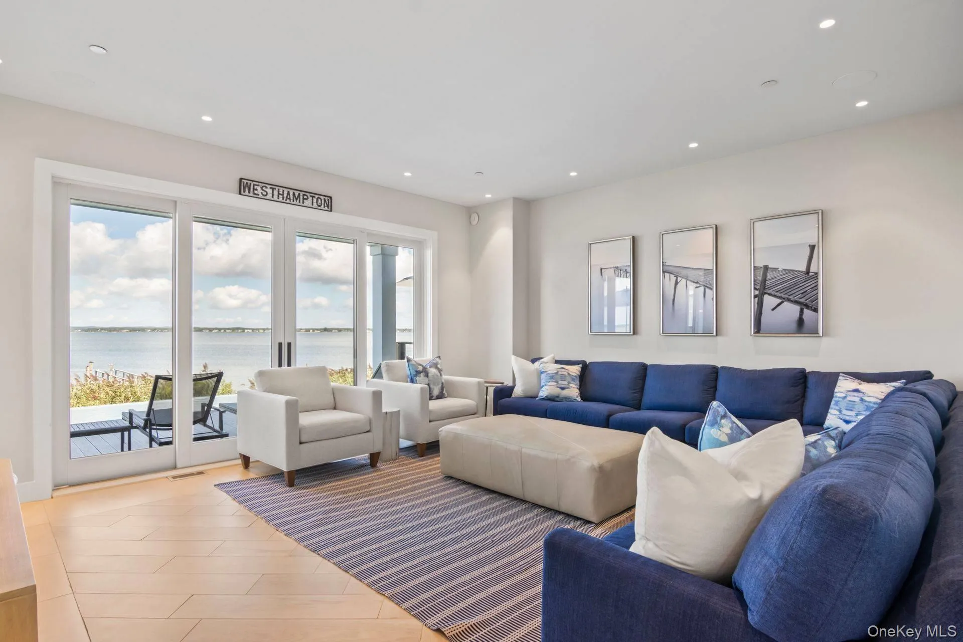 Media room/den with water views, and wood flooring Media room/den with water views, and wood flooring