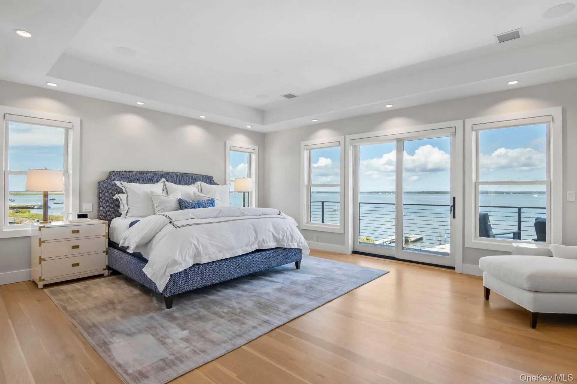 Primary Ensuite Bedroom and balcony with sweeping open bay views Primary Ensuite Bedroom and balcony with sweeping open bay views
