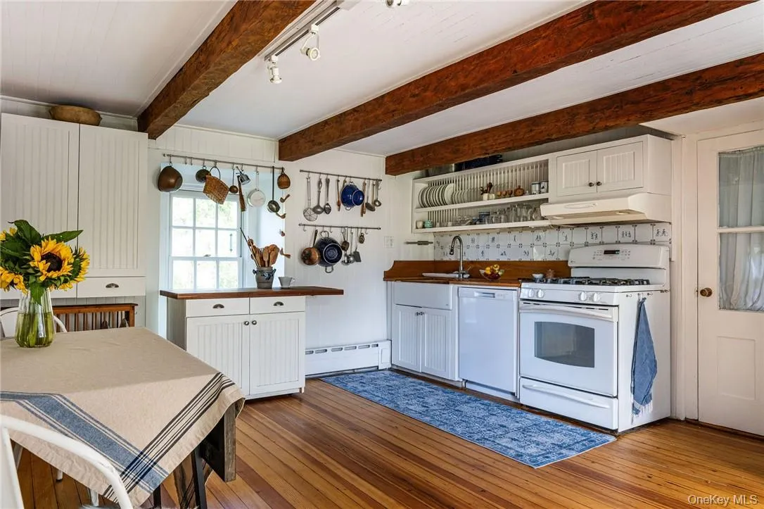 Country Eat-In Kitchen with beamed ceilings, gas range, dishwasher Country Eat-In Kitchen with beamed ceilings, gas range, dishwasher