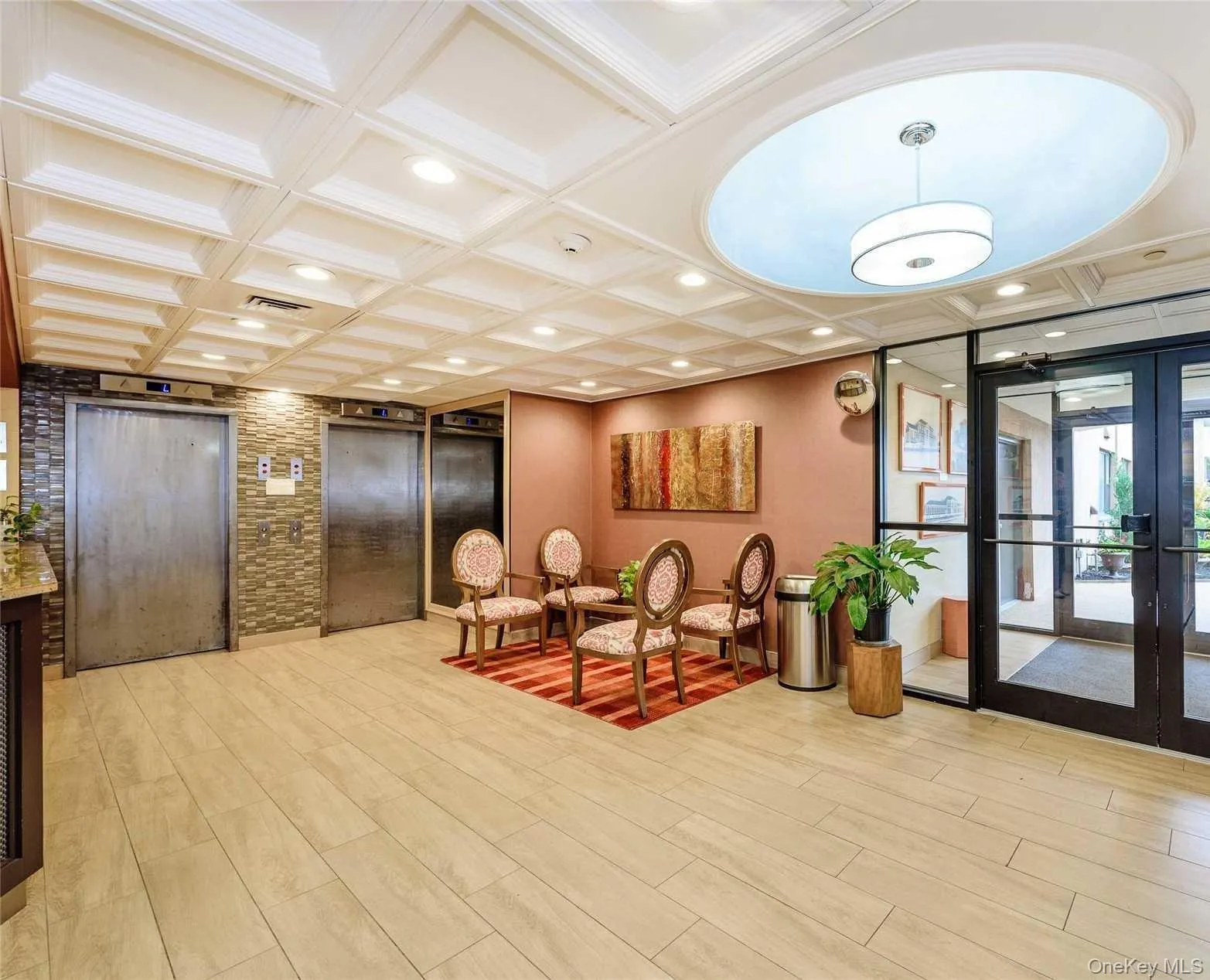 Building lobby with coffered ceiling and recessed lighting Building lobby with coffered ceiling and recessed lighting