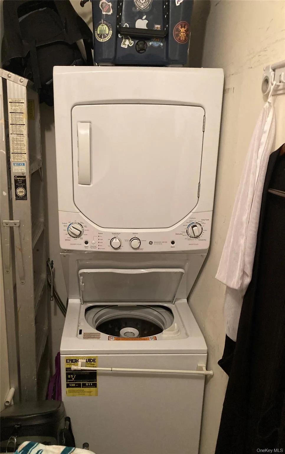 Washroom with stacked washing machine and dryer Washroom with stacked washing machine and dryer