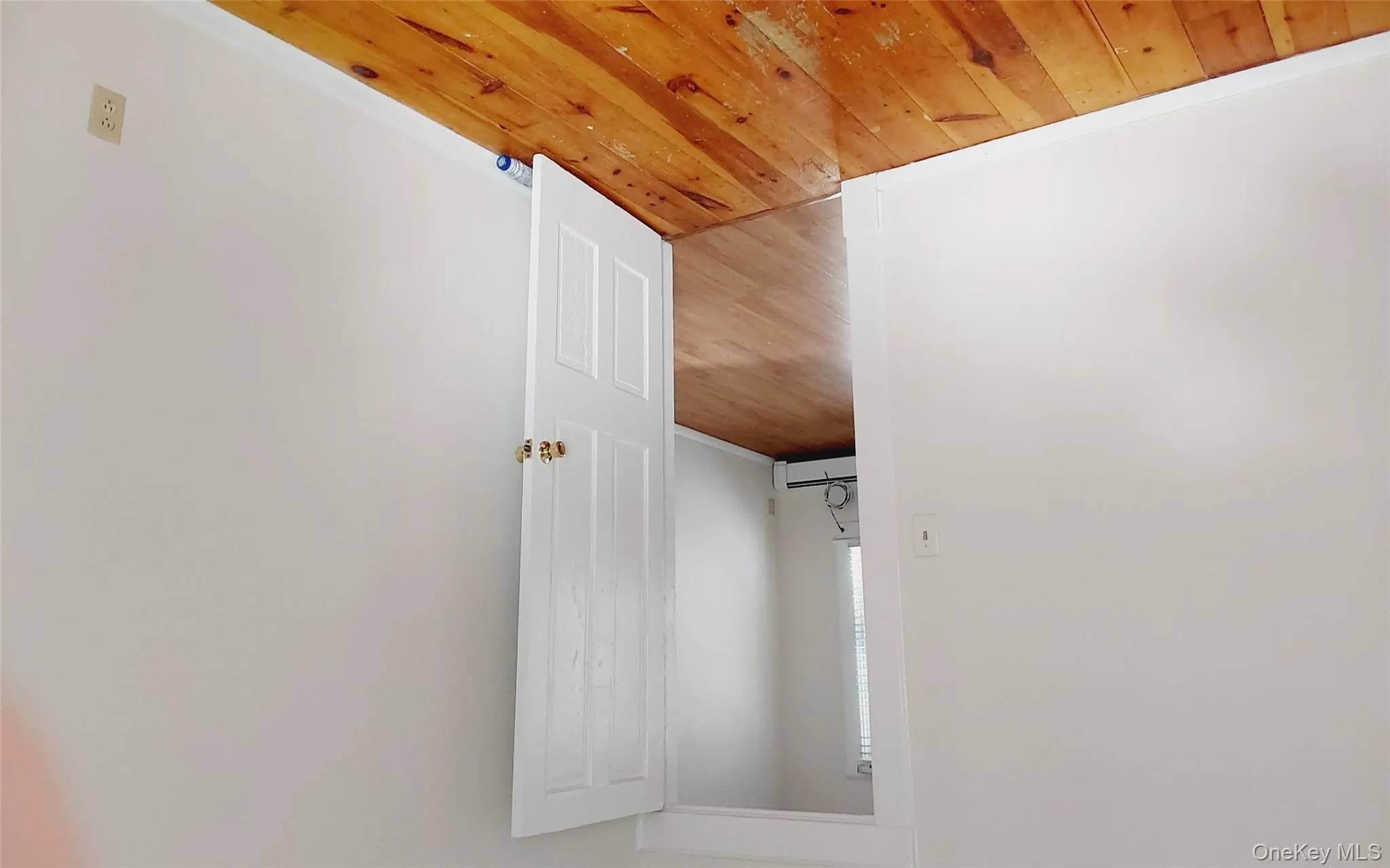 Spare room featuring light wood-style flooring and a baseboard radiator Spare room featuring light wood-style flooring and a baseboard radiator