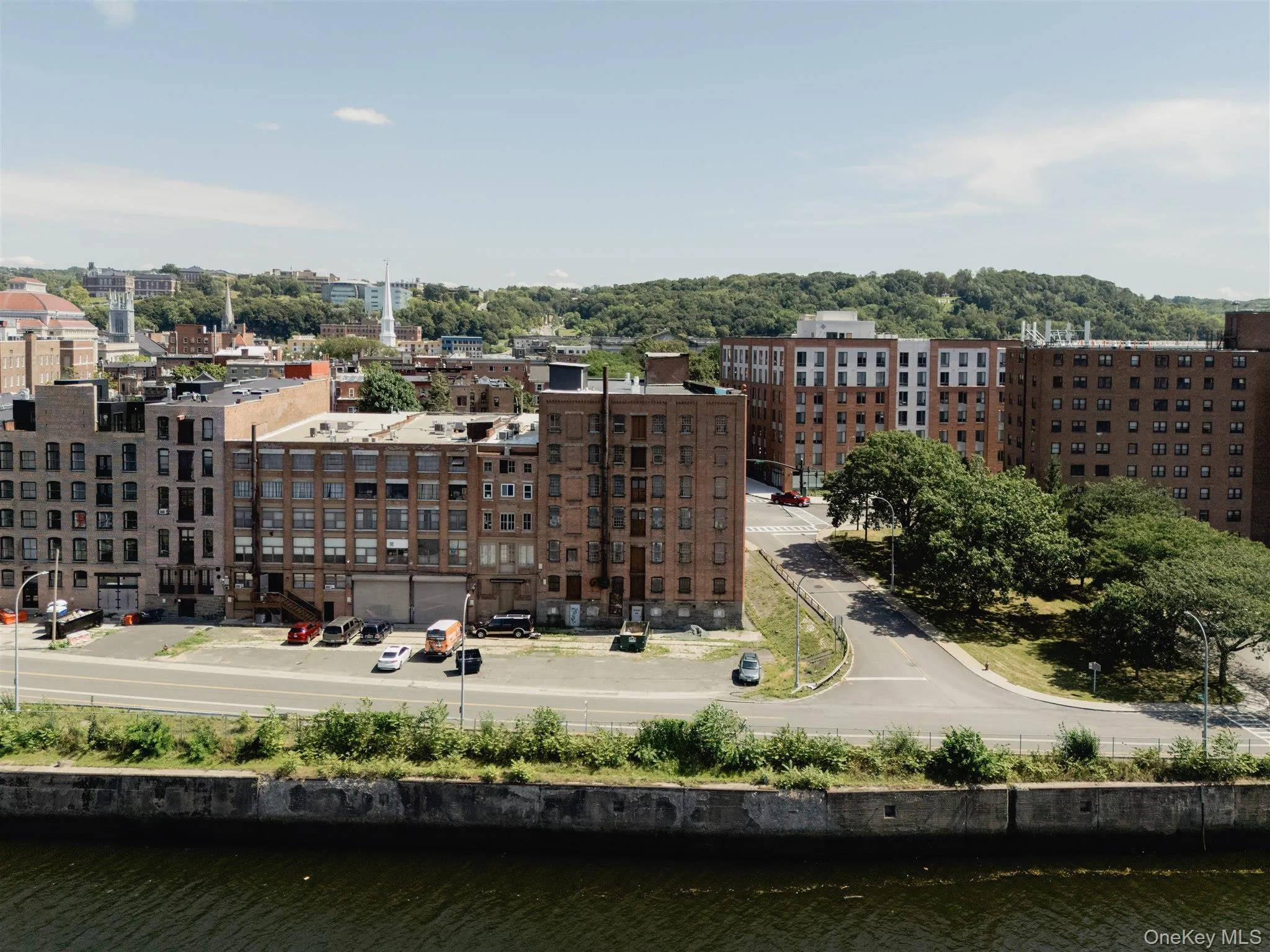 View of city with a nearby body of water View of city with a nearby body of water