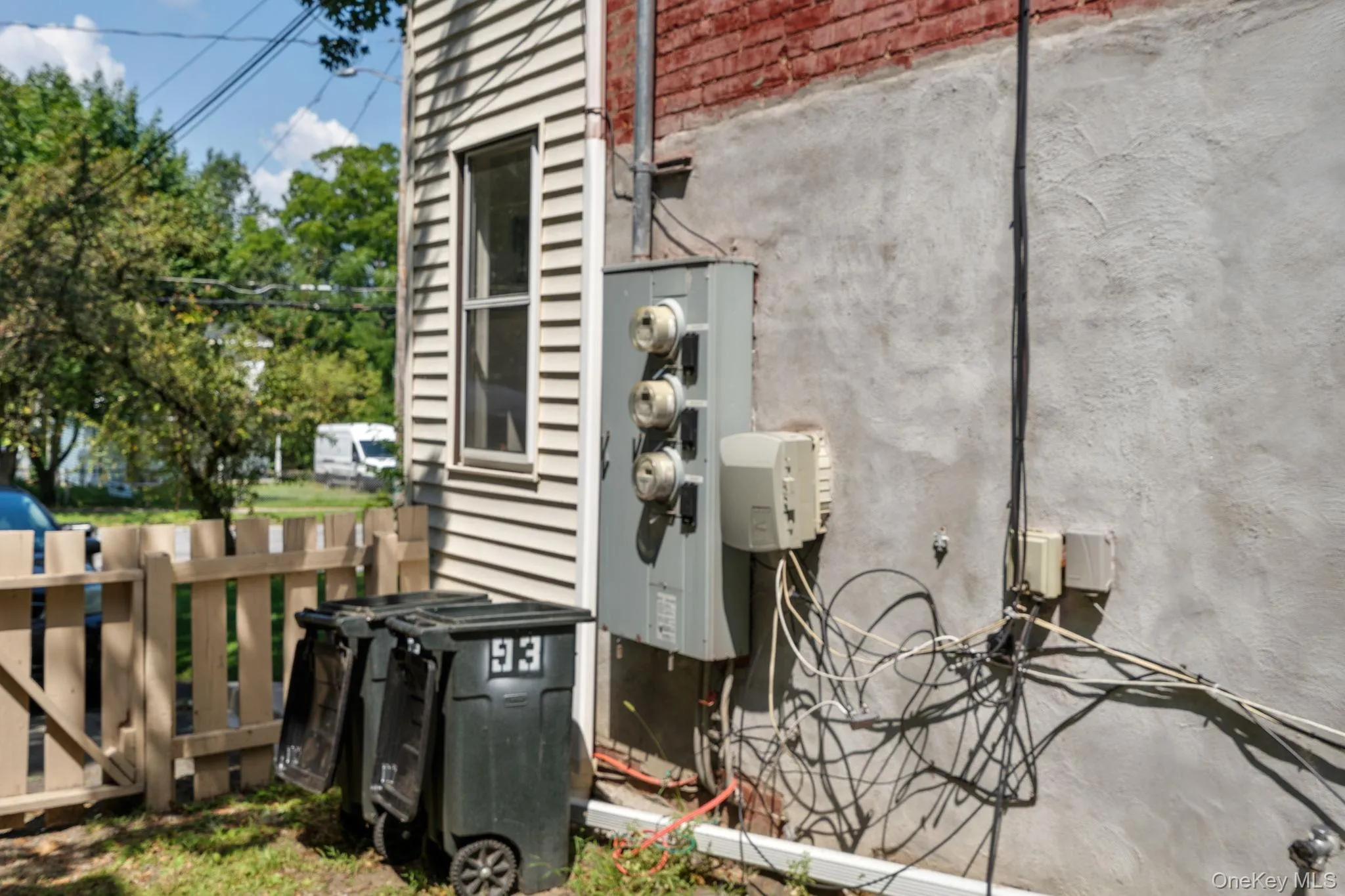 Exterior view of brick siding and stucco siding Exterior view of brick siding and stucco siding
