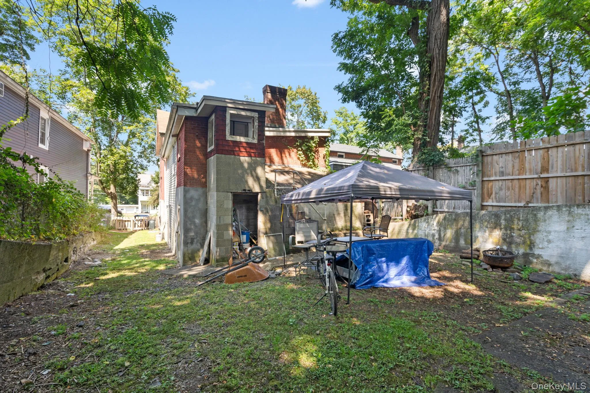 Rear view of house with a chimney and concrete block siding Rear view of house with a chimney and concrete block siding