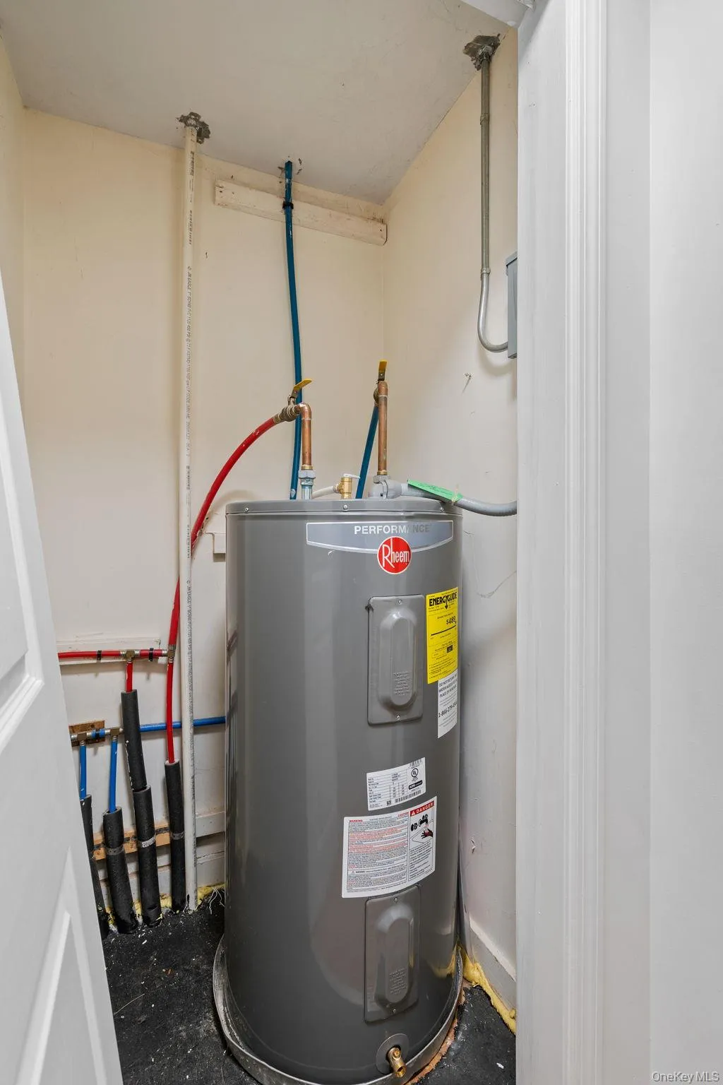 Utility room featuring water heater Utility room featuring water heater