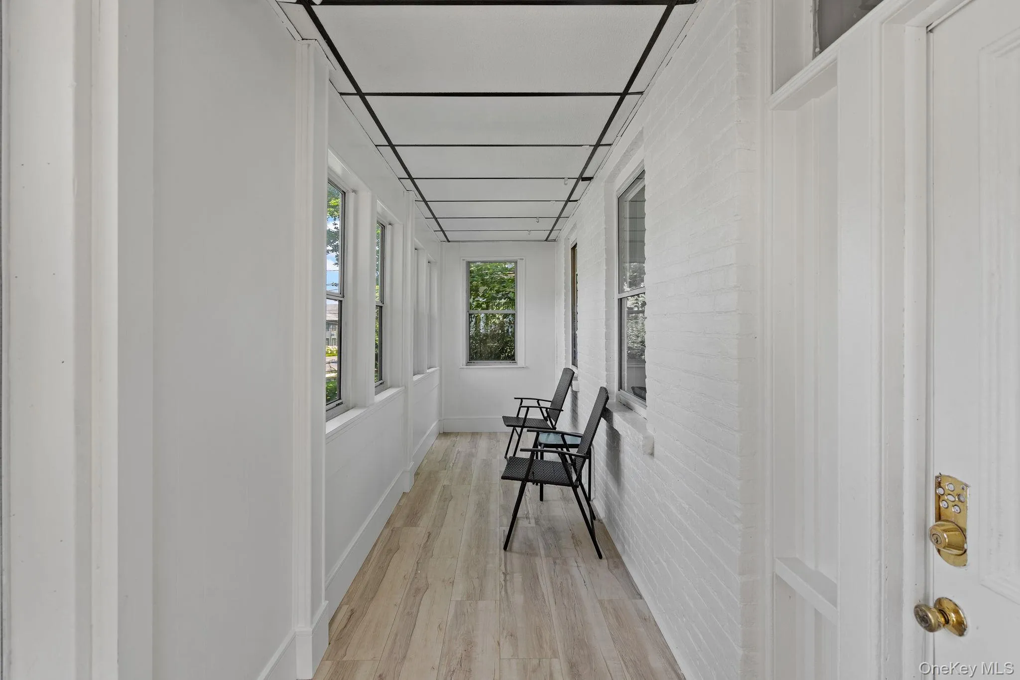Corridor with light wood-style flooring Corridor with light wood-style flooring