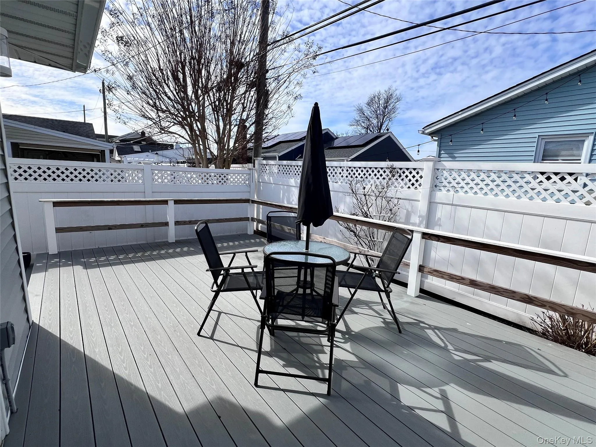 Deck featuring outdoor dining area and fence Deck featuring outdoor dining area and fence