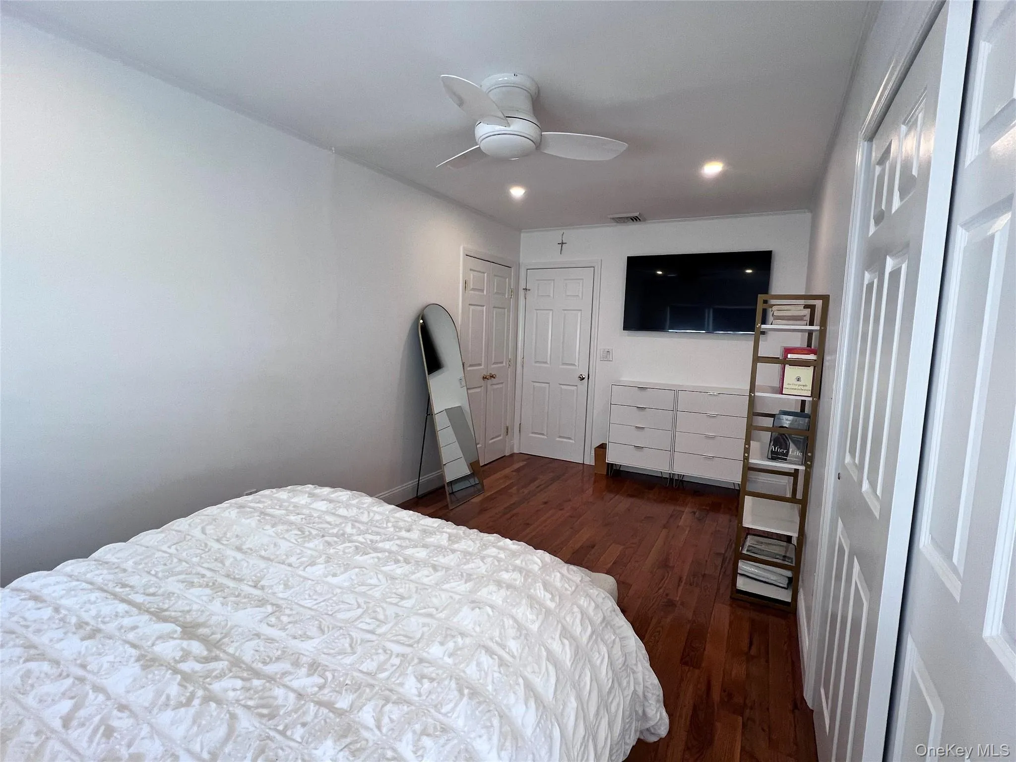 Bedroom featuring baseboards, visible vents, a ceiling fan, dark wood-style flooring, and recessed lighting Bedroom featuring baseboards, visible vents, a ceiling fan, dark wood-style flooring, and recessed lighting