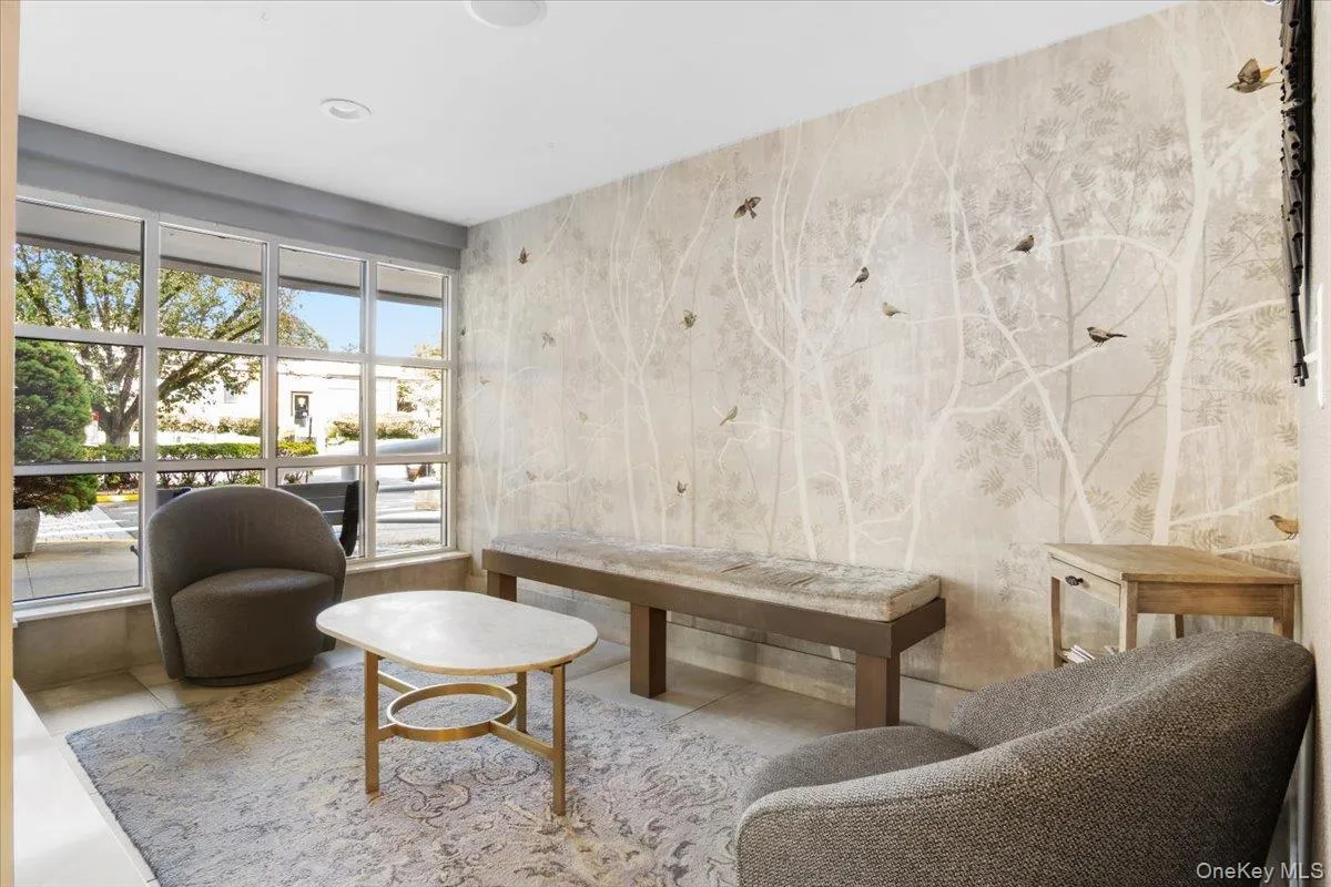 Sitting room featuring tile patterned floors Sitting room featuring tile patterned floors