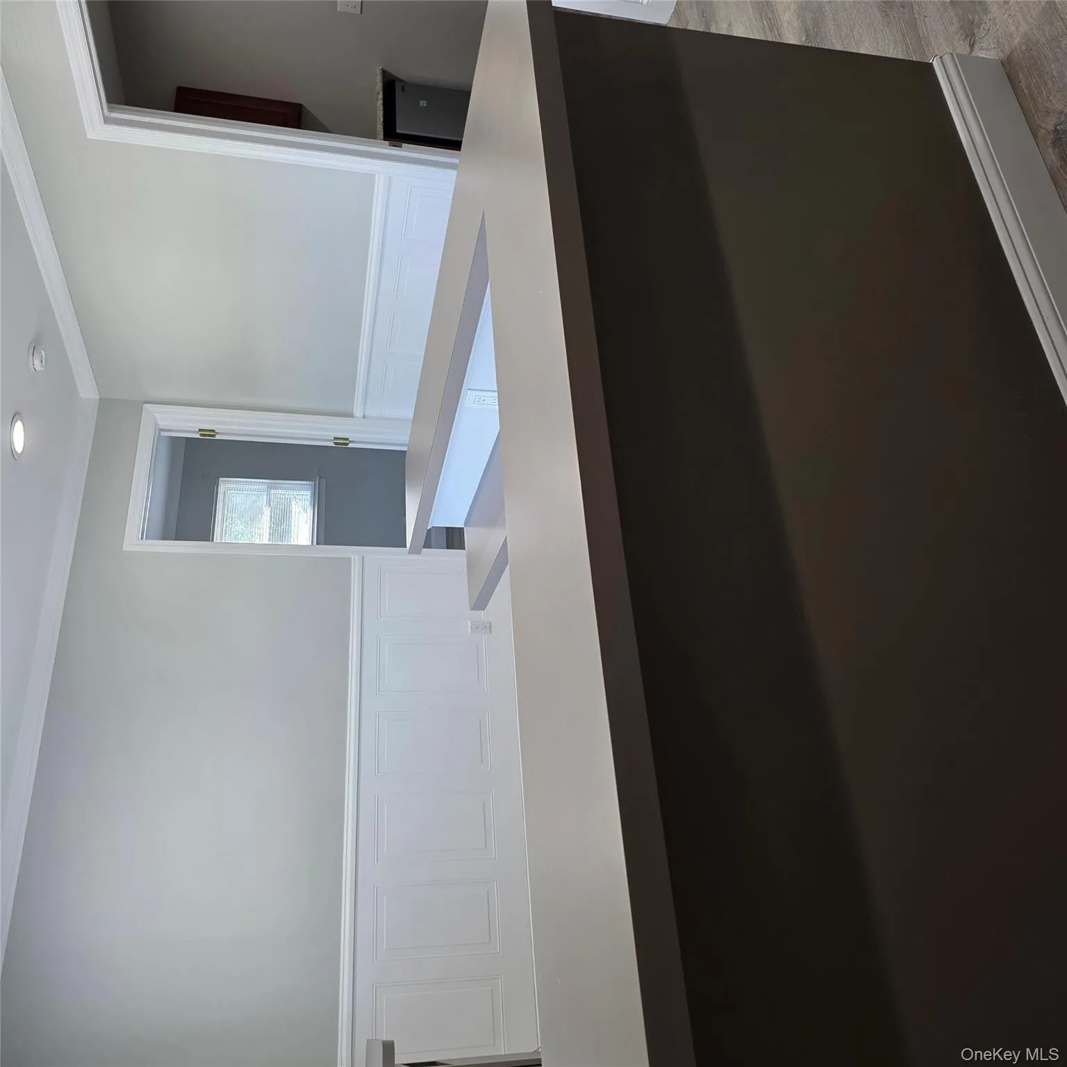 Bathroom featuring ornamental molding, recessed lighting, a decorative wall, and a wainscoted wall Bathroom featuring ornamental molding, recessed lighting, a decorative wall, and a wainscoted wall
