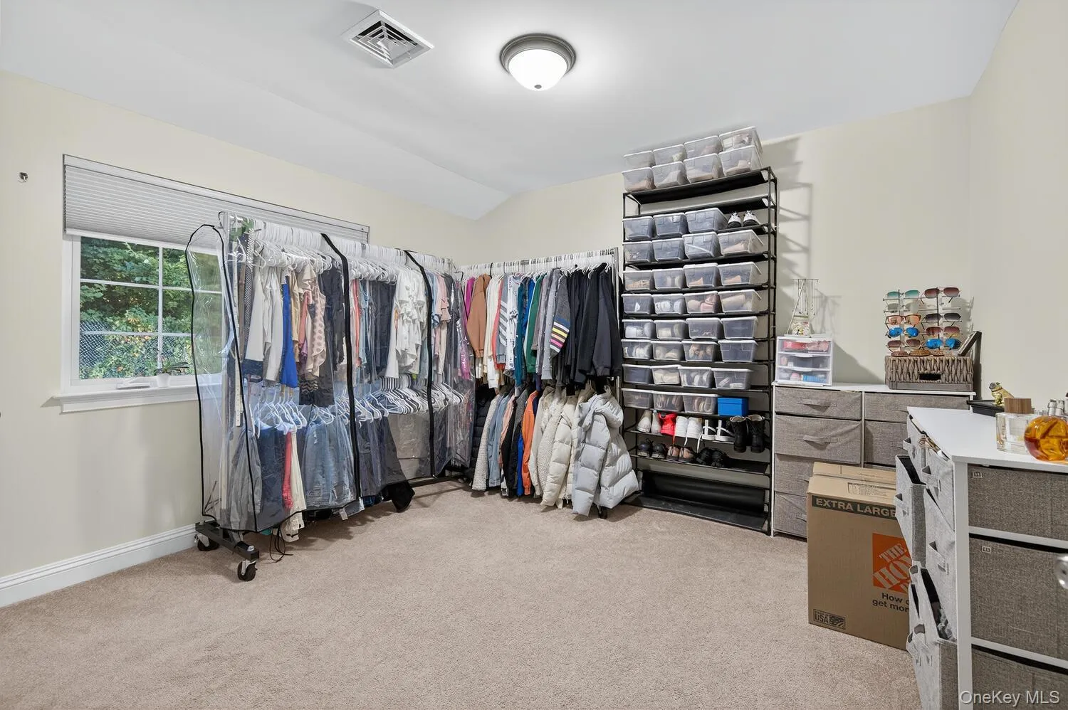 Walk in closet with light carpet Walk in closet with light carpet