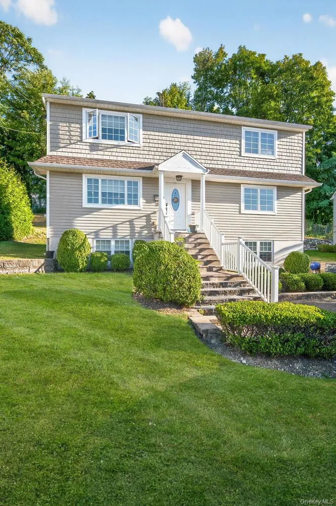 View of front facade featuring a front yard View of front facade featuring a front yard