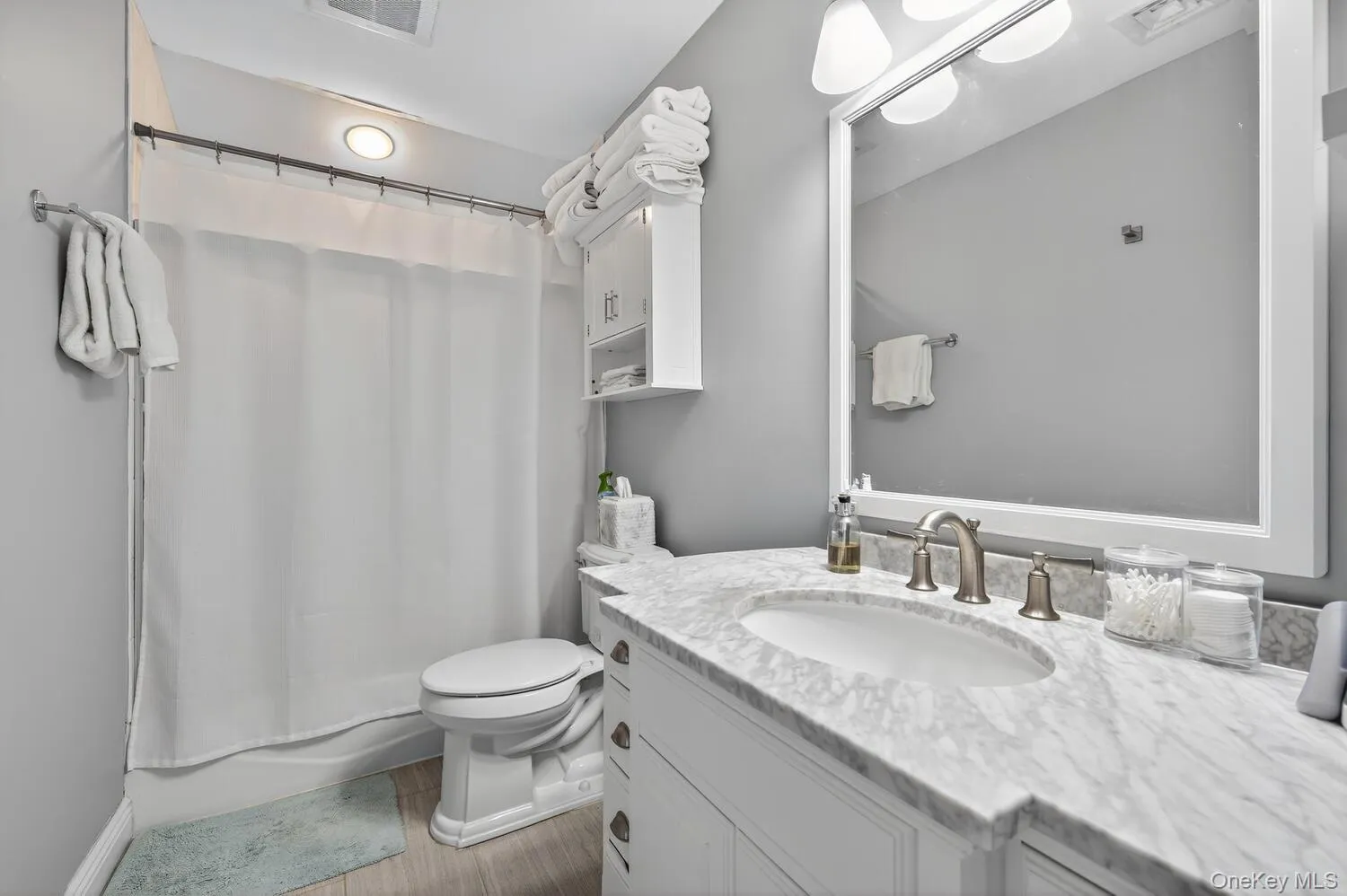 Full bath with vanity and shower / bath combo with shower curtain Full bath with vanity and shower / bath combo with shower curtain