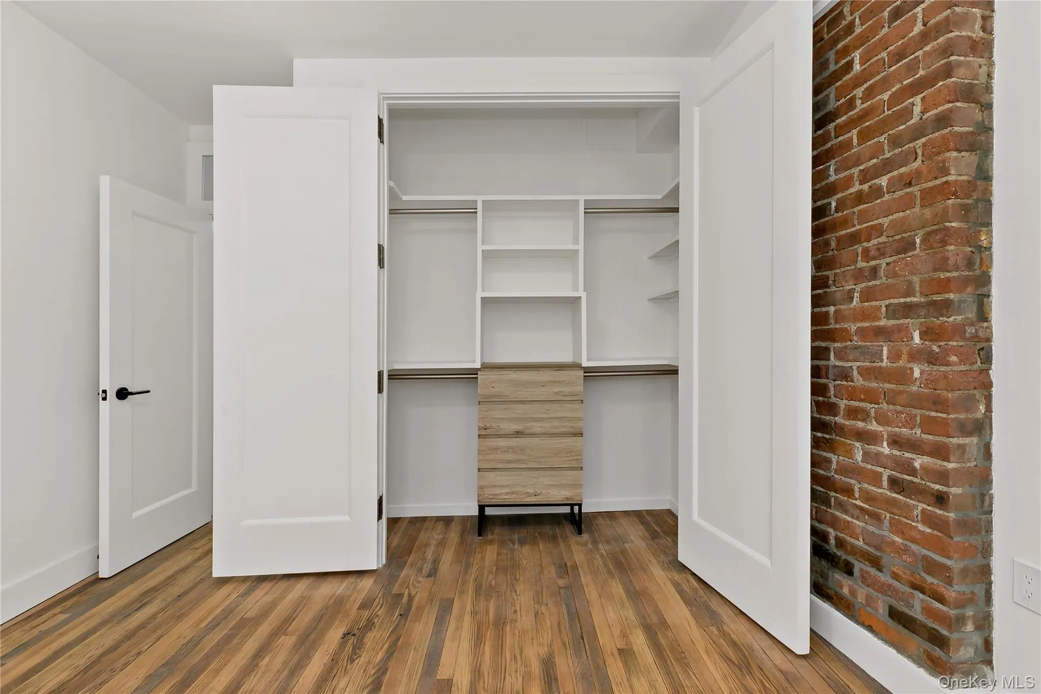 View of closet with custom built ins View of closet with custom built ins