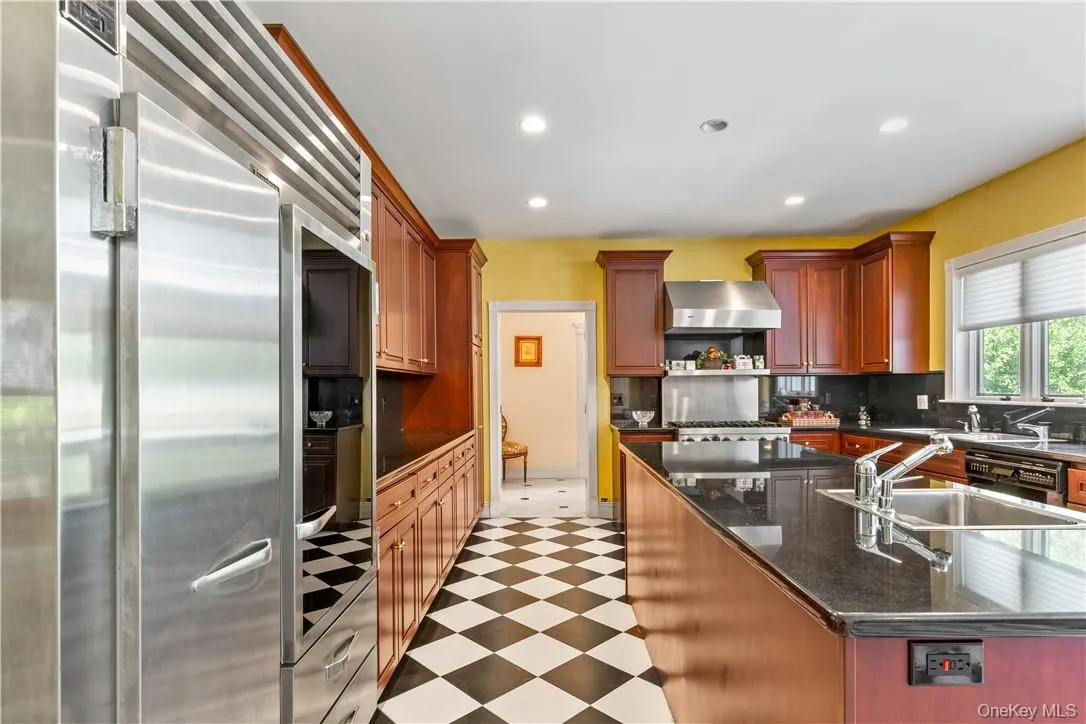 Beautiful custom Cherry cabinets with granite counters and large island Beautiful custom Cherry cabinets with granite counters and large island