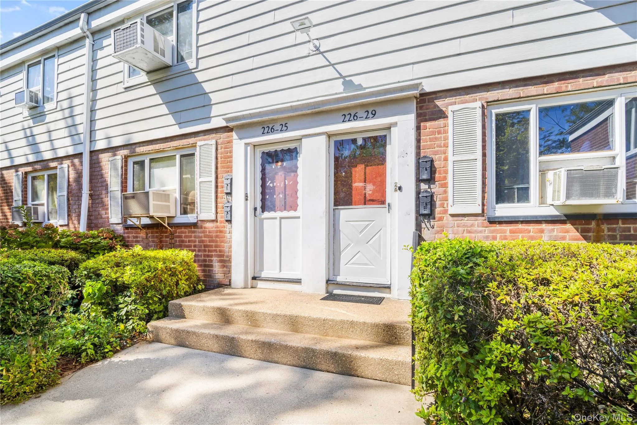 Doorway to property with brick siding Doorway to property with brick siding