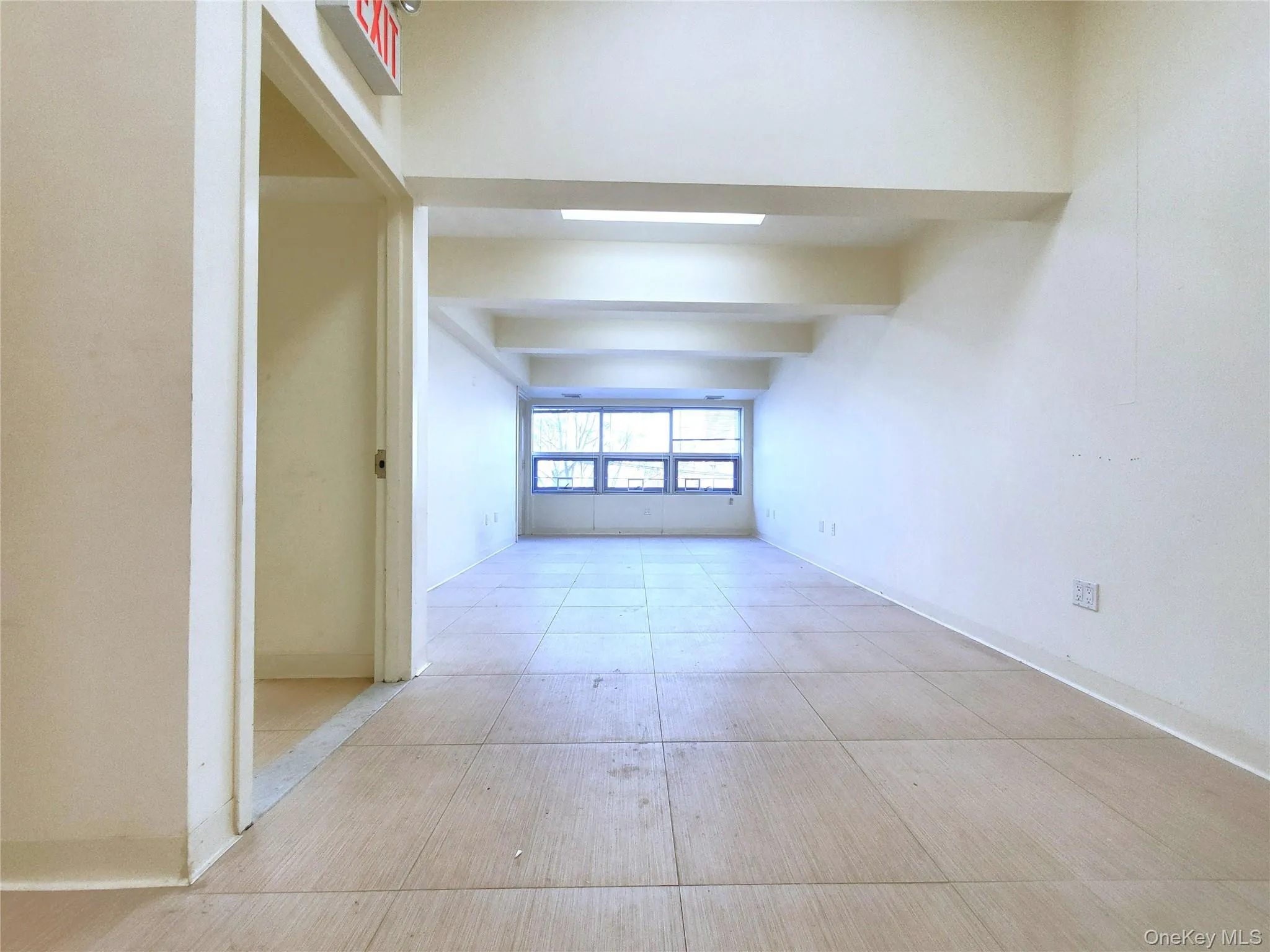Hallway featuring baseboards Hallway featuring baseboards