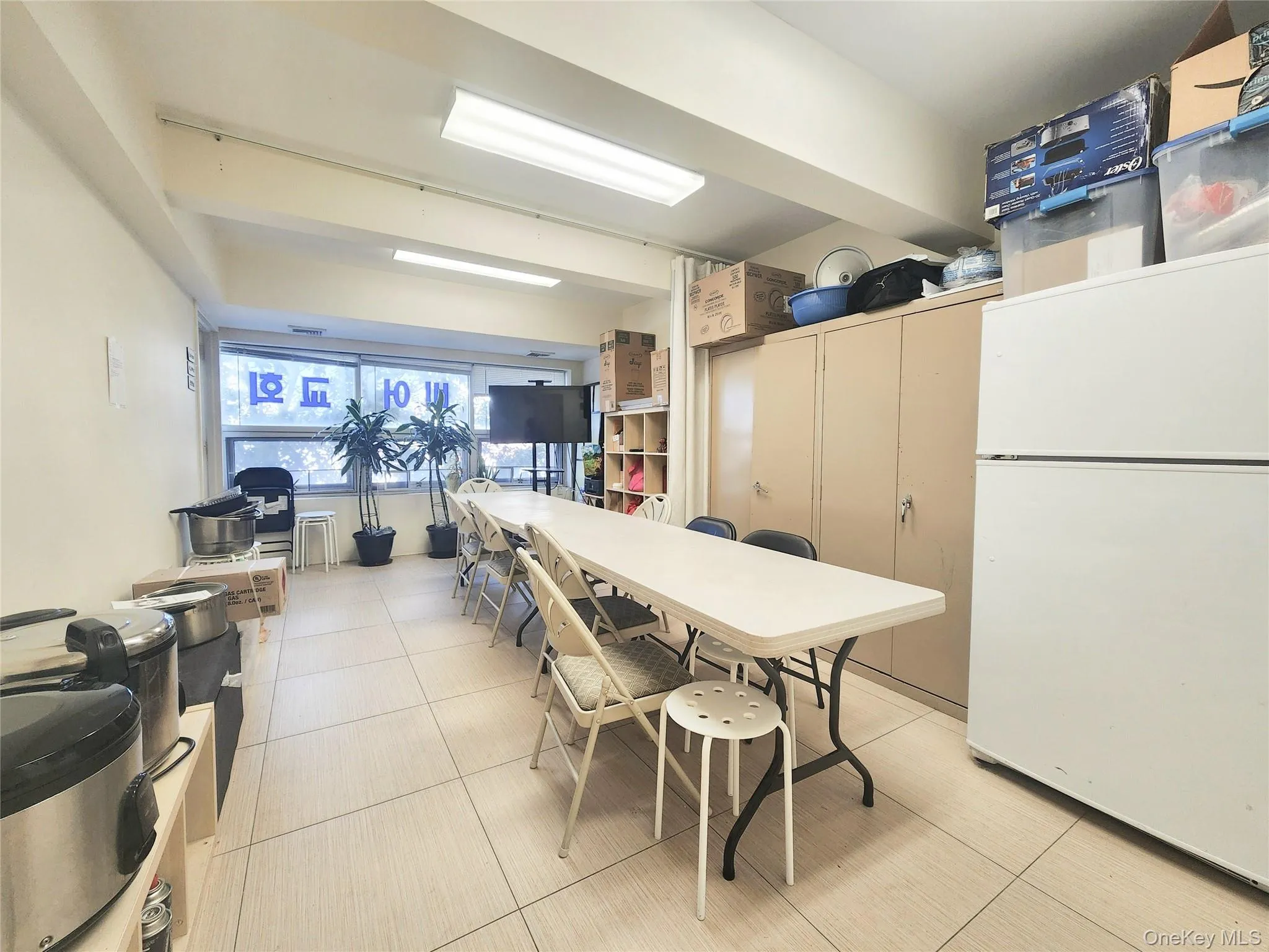 Dining space with light tile patterned floors Dining space with light tile patterned floors