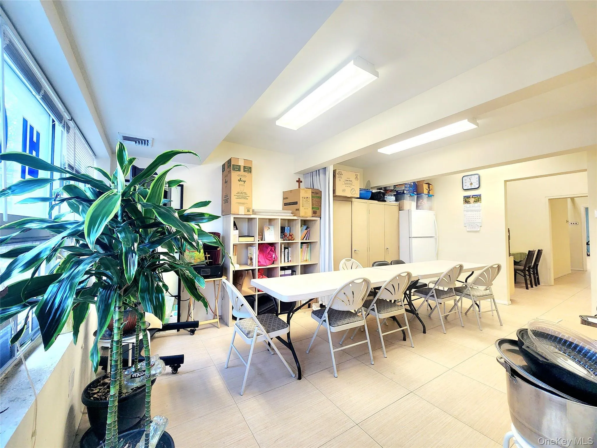 Dining space with light tile patterned floors Dining space with light tile patterned floors