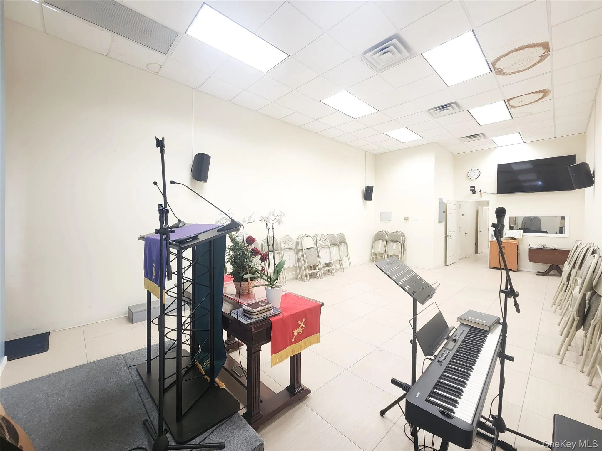 Exercise area with a drop ceiling and light tile patterned floors Exercise area with a drop ceiling and light tile patterned floors