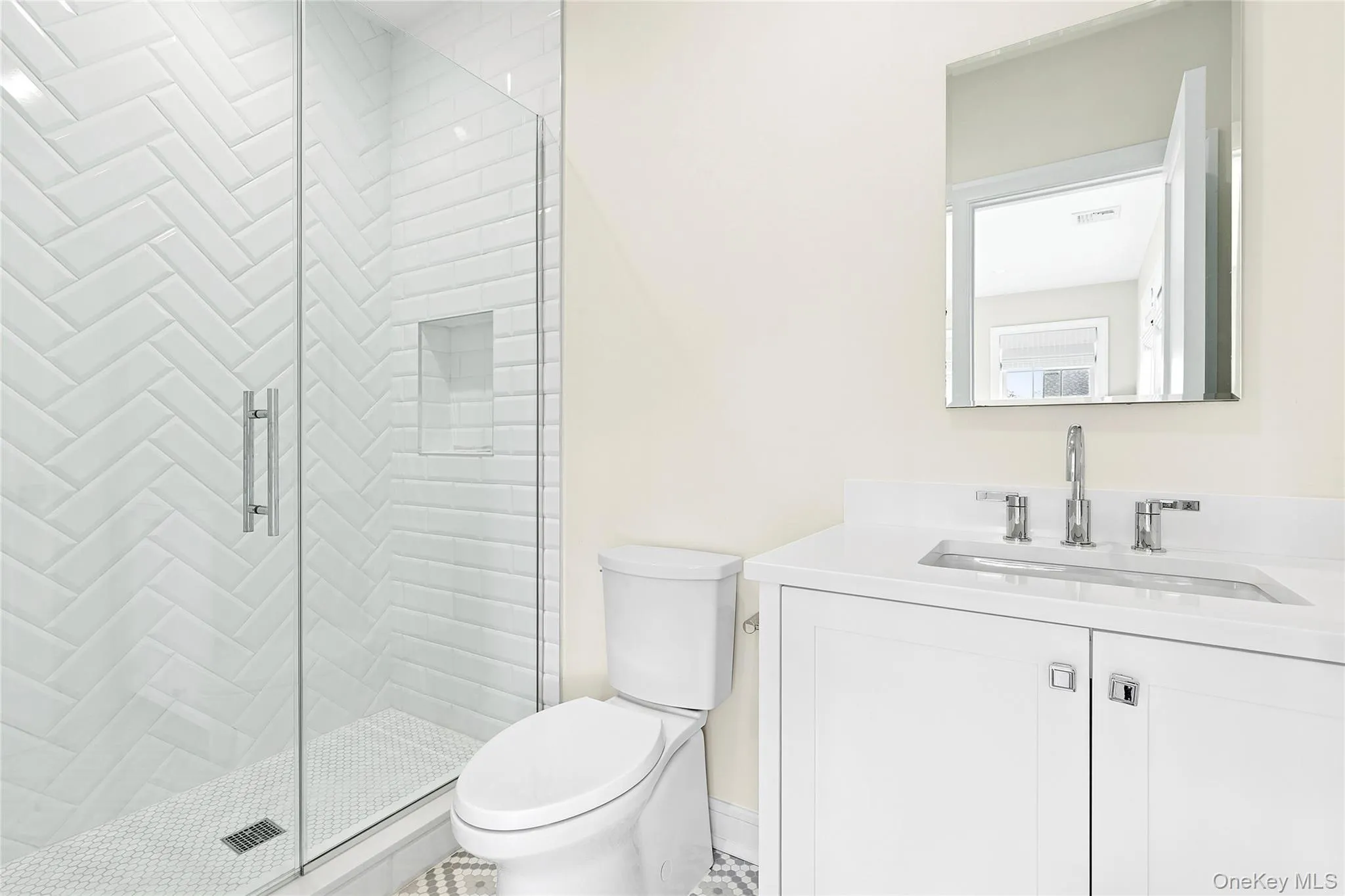 Full bath with vanity, a stall shower, and tile patterned flooring Full bath with vanity, a stall shower, and tile patterned flooring