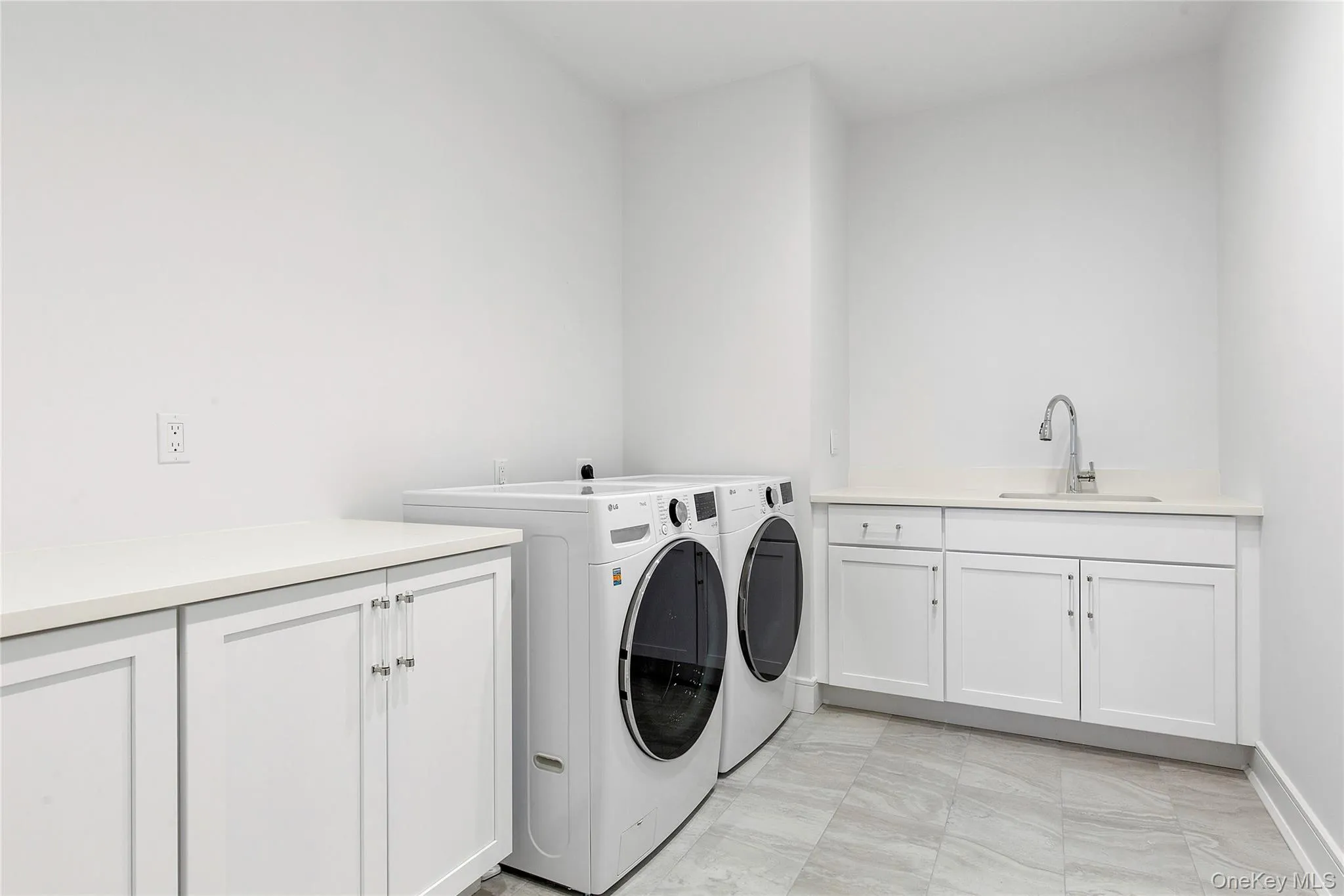 Laundry area featuring cabinet space and washer and dryer Laundry area featuring cabinet space and washer and dryer