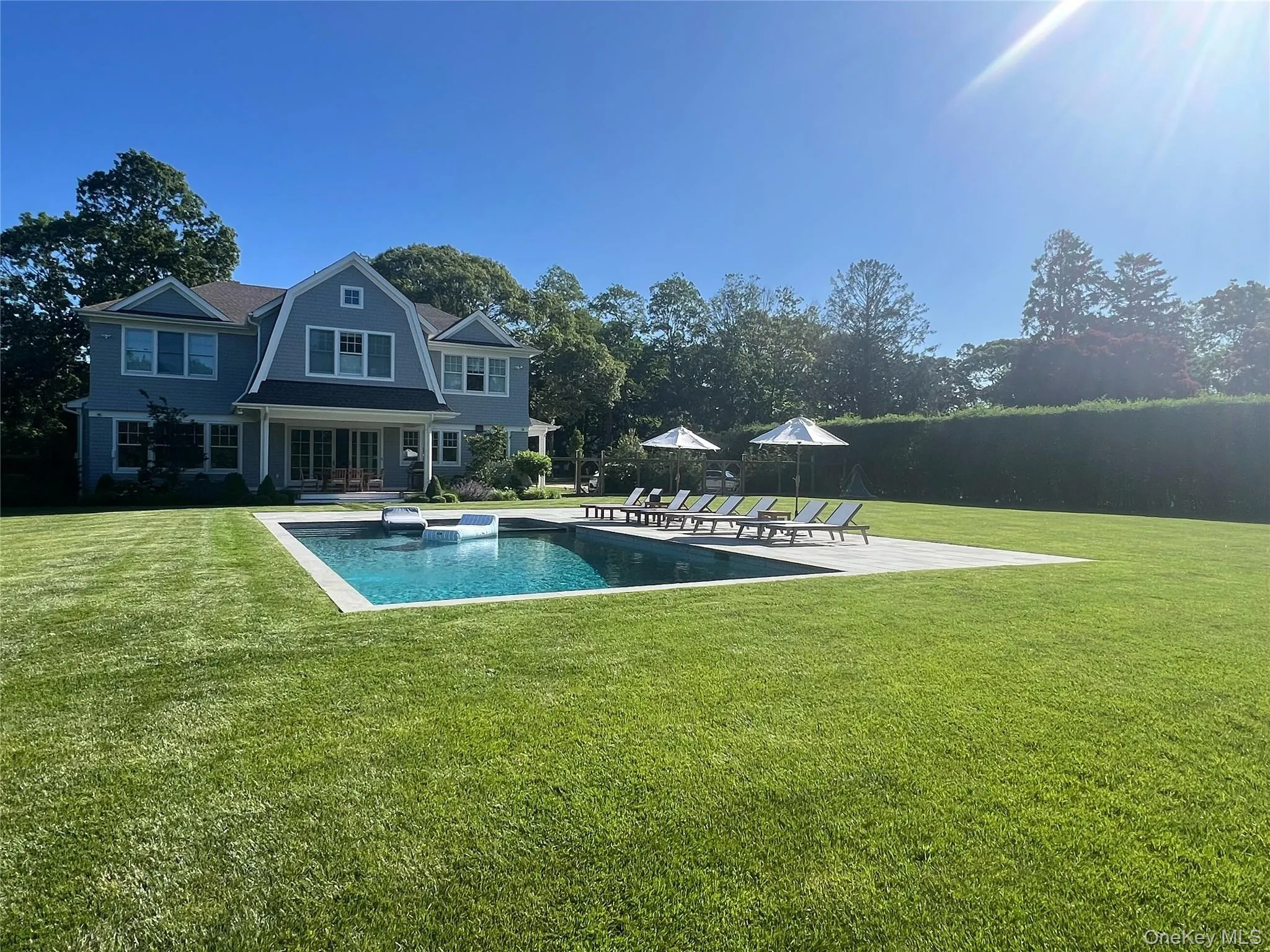 Outdoor pool featuring a patio and a yard Outdoor pool featuring a patio and a yard