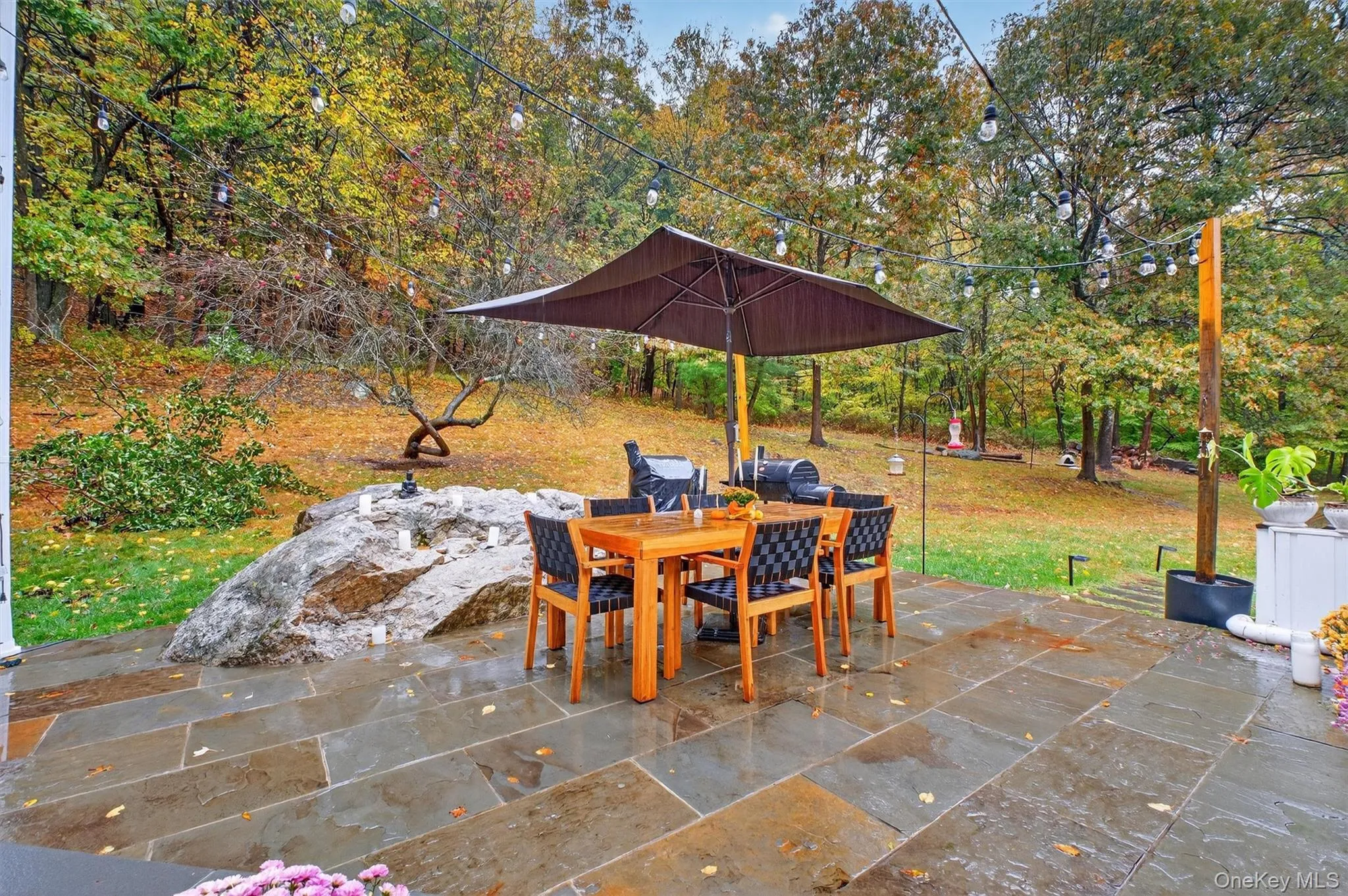 View of patio with outdoor dining area and area for grilling View of patio with outdoor dining area and area for grilling