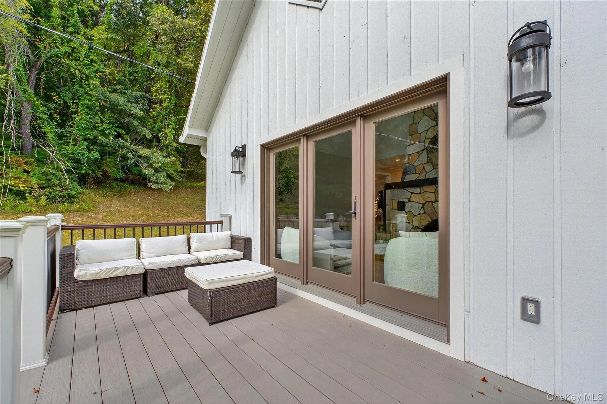 Deck off of the living area with outdoor lounge set Deck off of the living area with outdoor lounge set
