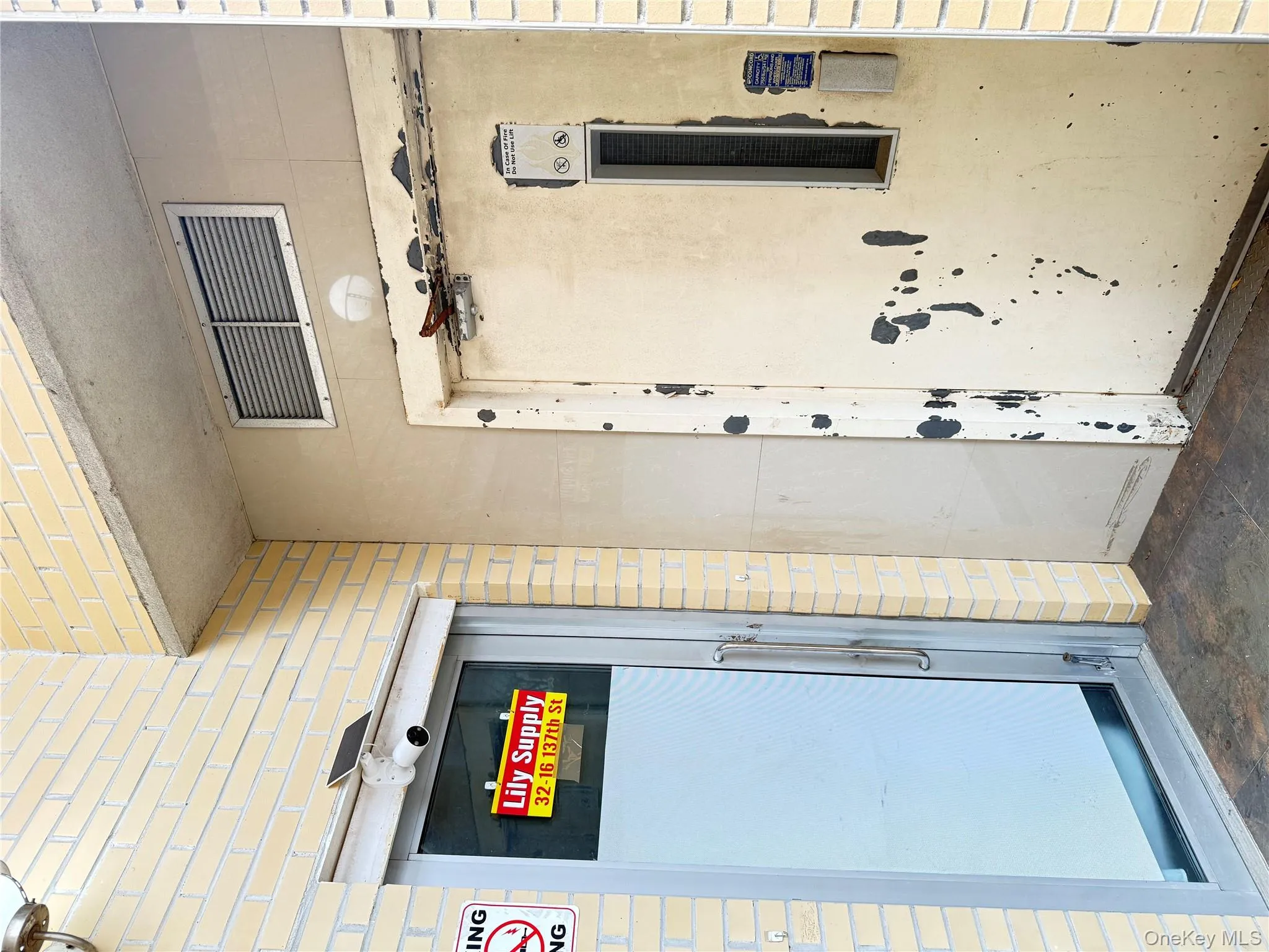 View of exterior entry with brick siding View of exterior entry with brick siding