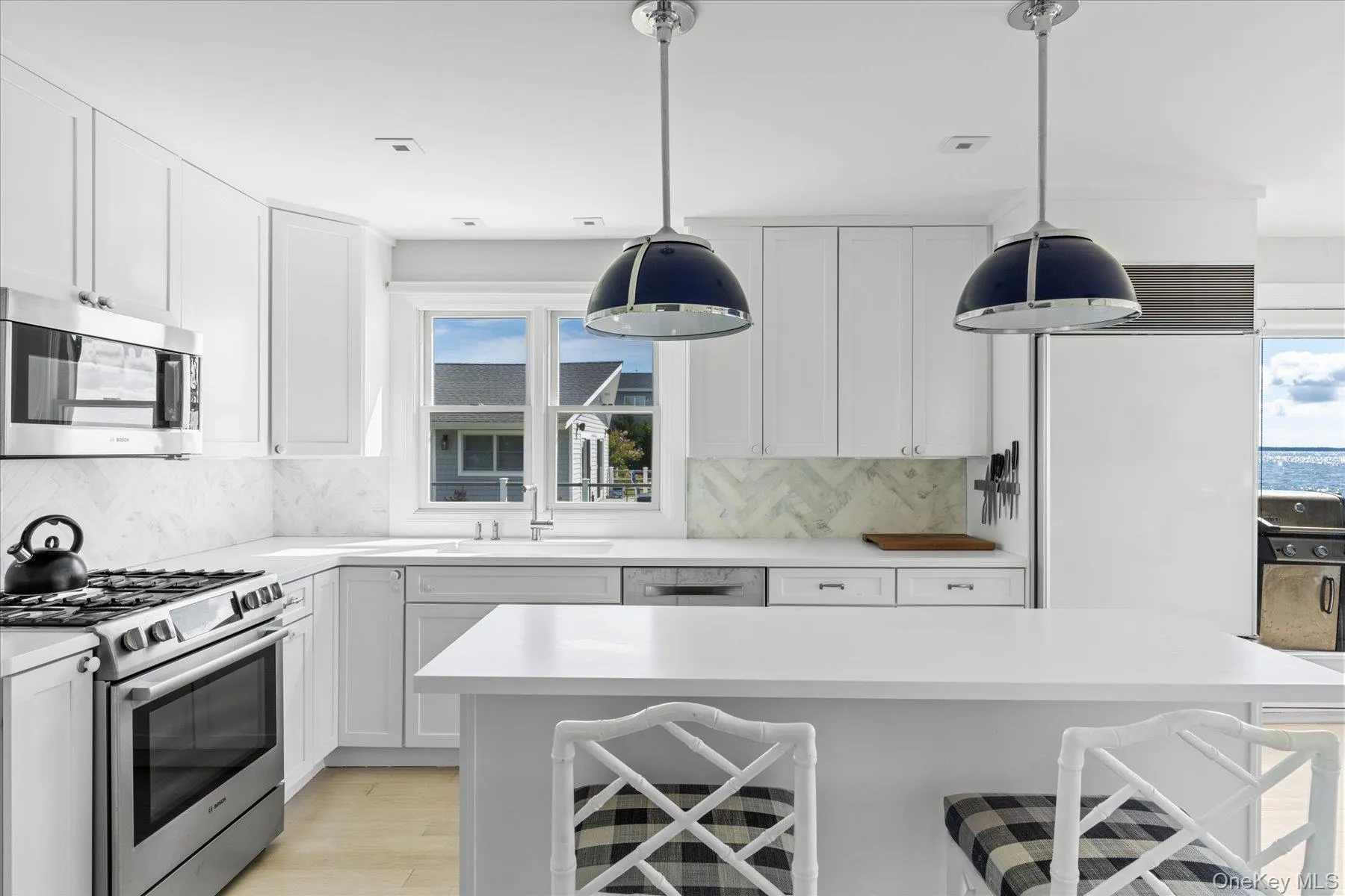 Custom designed kitchen boasting top amenities and additional prep space. Custom designed kitchen boasting top amenities and additional prep space.