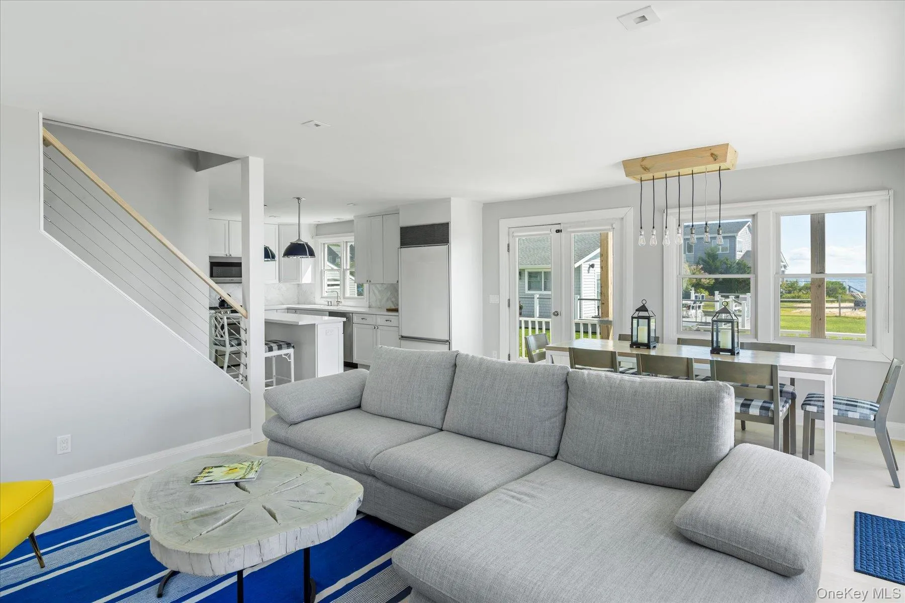 Open and airy living space designed to maximize waterfront scenery. Open and airy living space designed to maximize waterfront scenery.