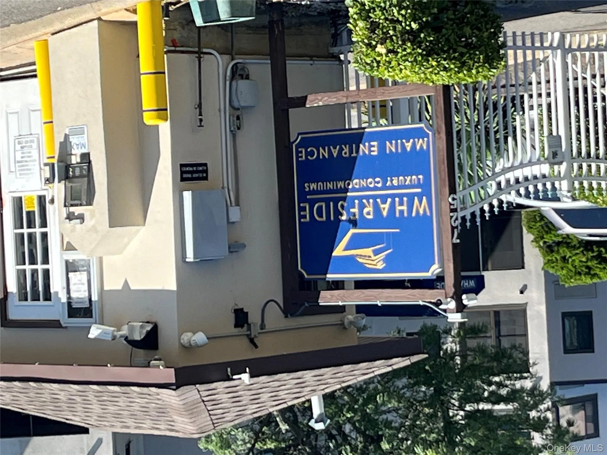 Exterior view of stucco siding and a shingled roof Exterior view of stucco siding and a shingled roof