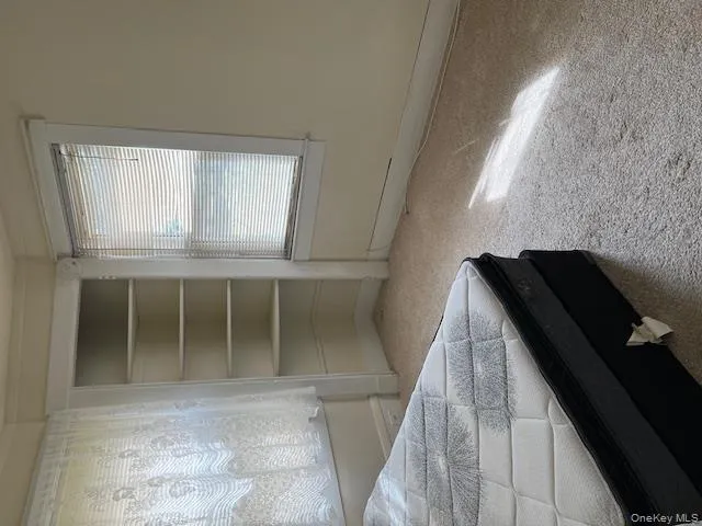 Unfurnished bedroom featuring carpet flooring and a closet Unfurnished bedroom featuring carpet flooring and a closet