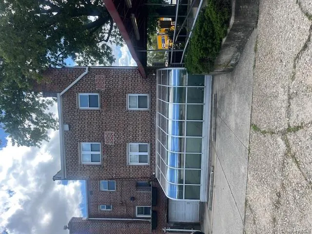 Rear view of house with brick siding and a chimney Rear view of house with brick siding and a chimney