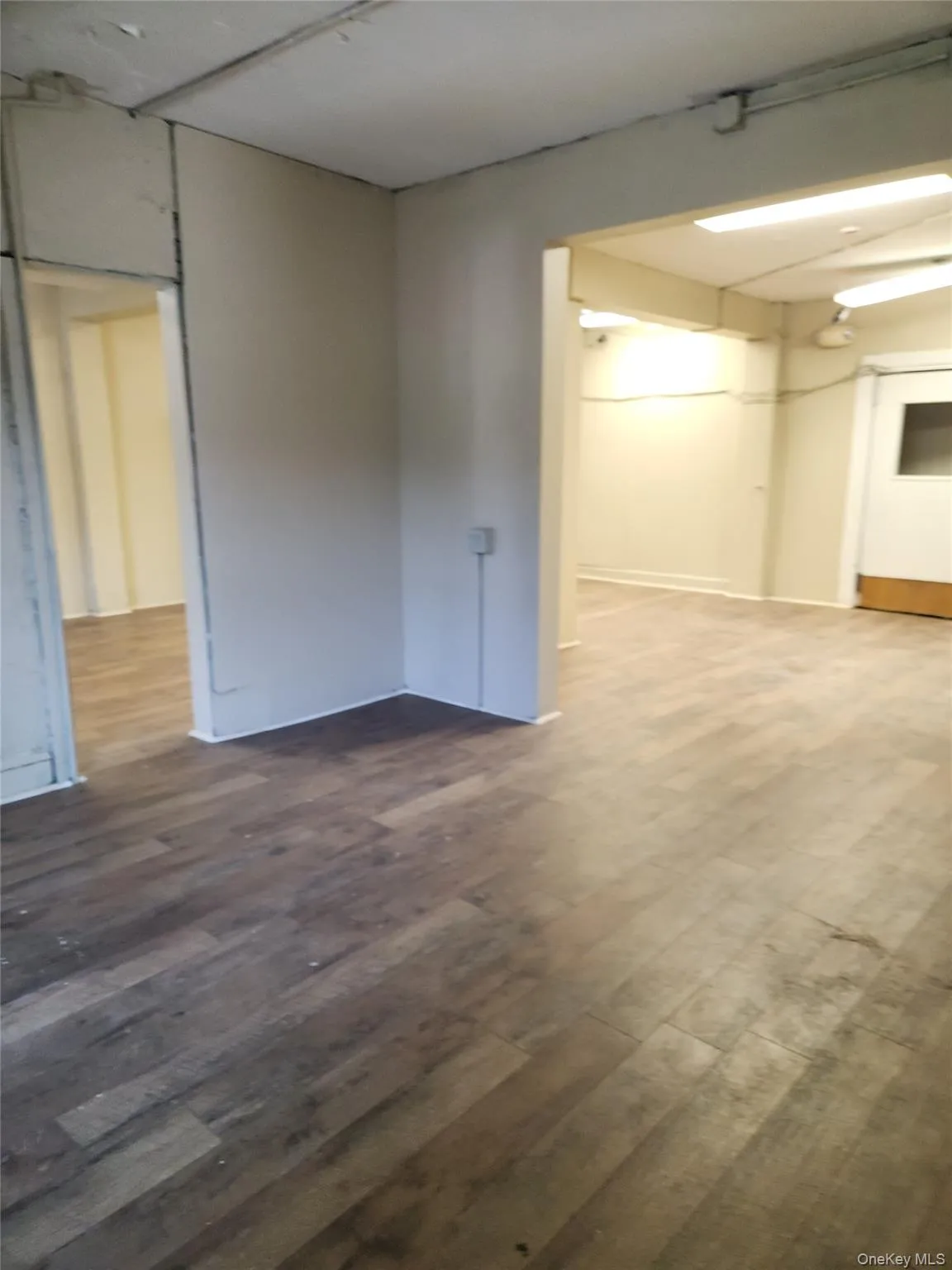 Empty room featuring dark wood-type flooring Empty room featuring dark wood-type flooring